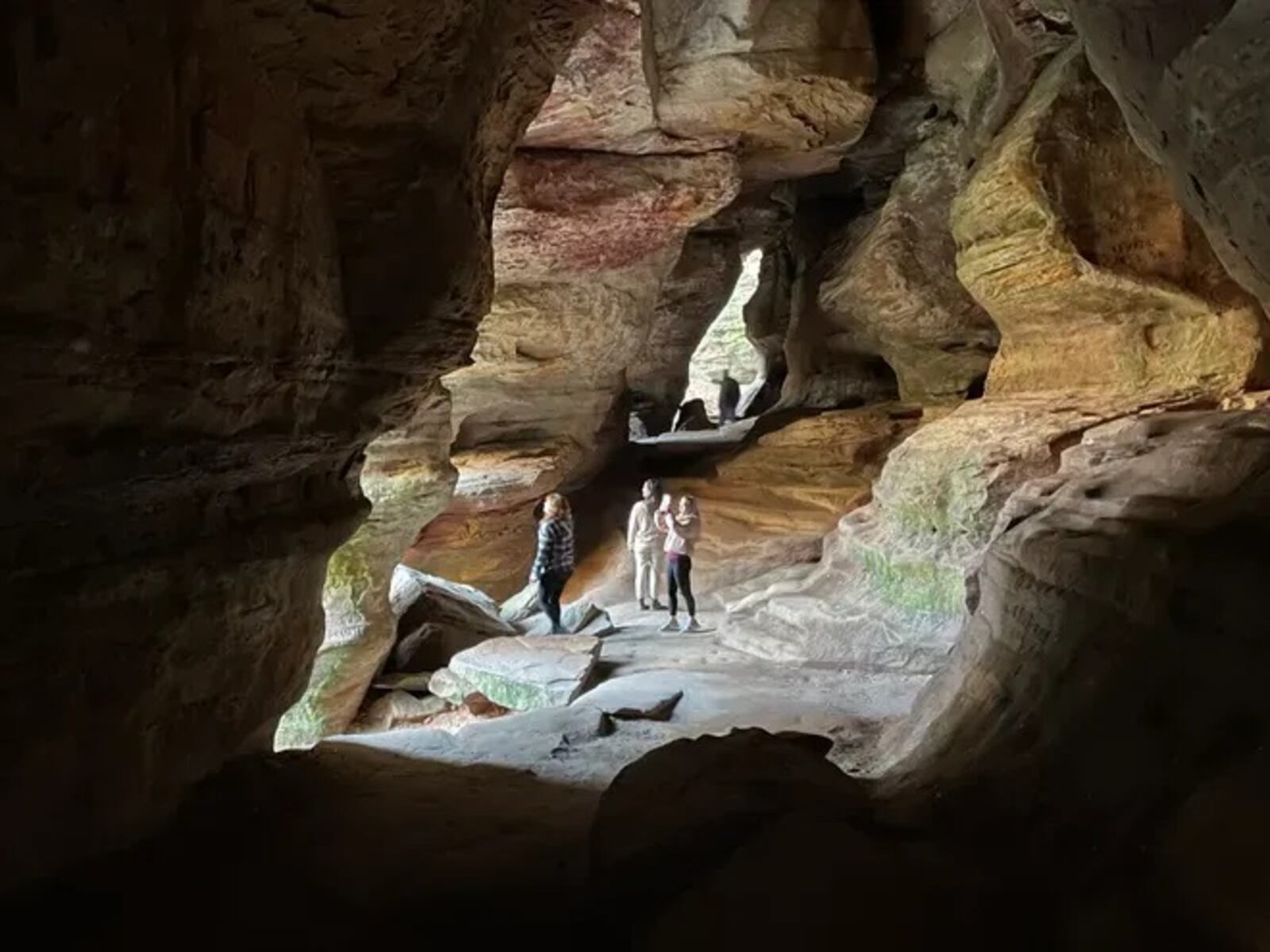 Visitors explore Rock House in Hocking Hills State Park. STEVE STEPHENS/SPECIAL TO THE COLUMBUS DISPATCH