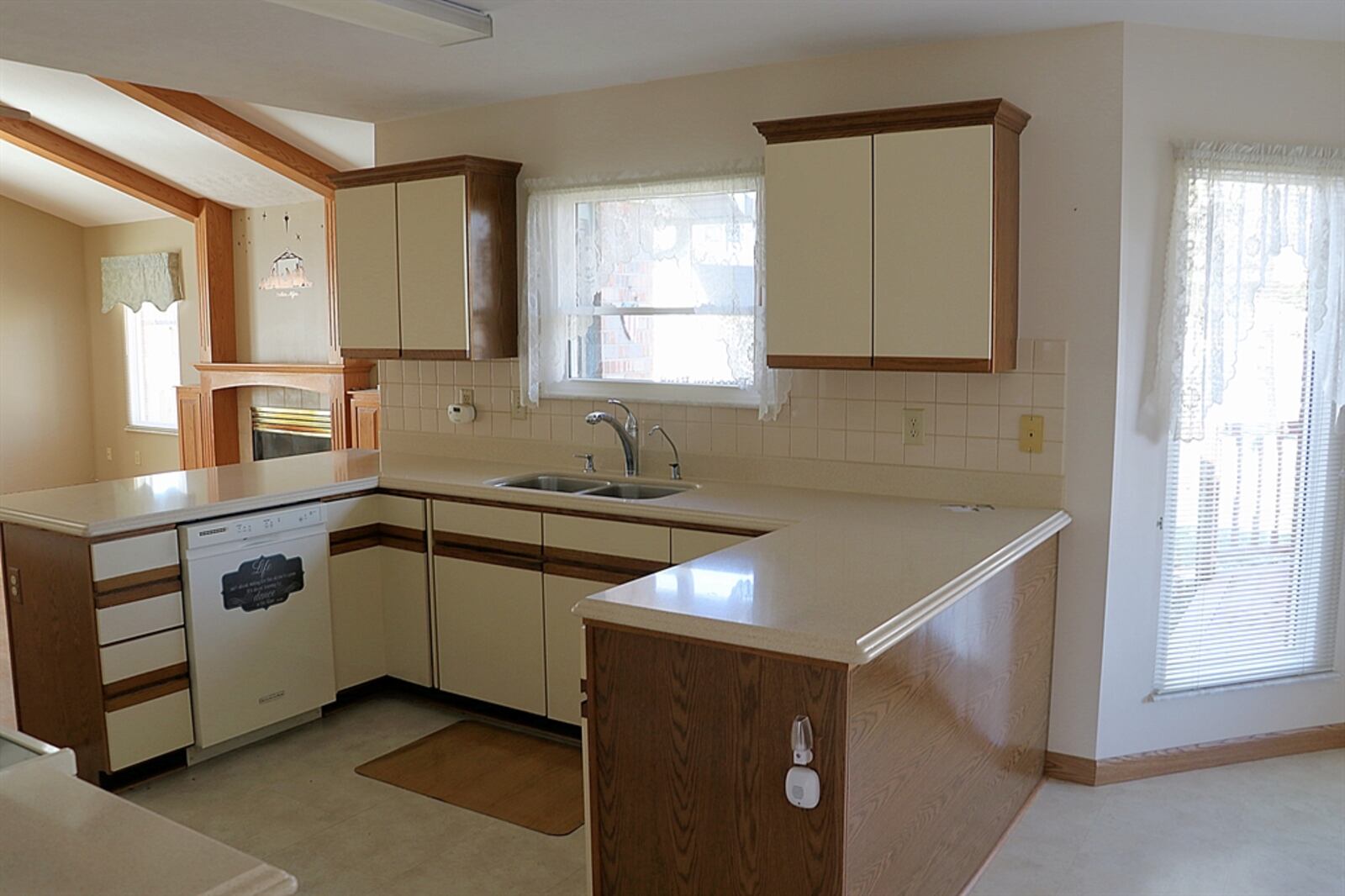 Two peninsula counters divide the U-shaped kitchen from the breakfast room and the great room and offer plenty of workspace.