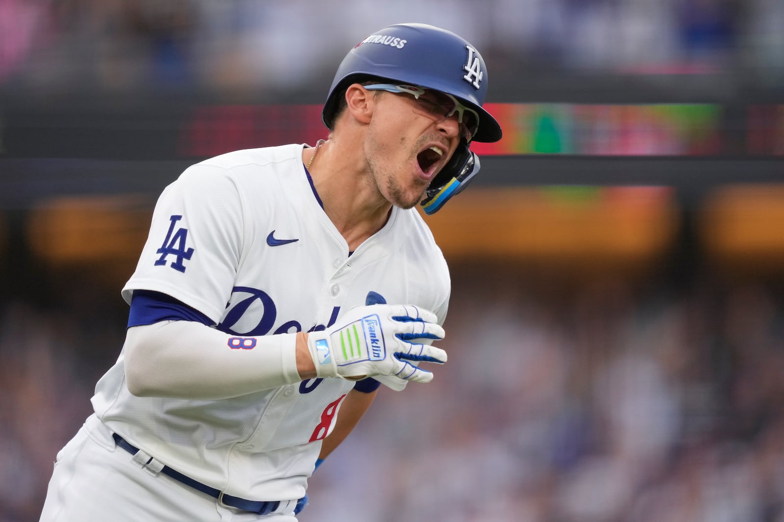 Los Angeles Dodgers' Kiké Hernández celebrates as he rounds first base following his solo home run during the second inning in Game 5 of a baseball NL Division Series against the San Diego Padres, Friday, Oct. 11, 2024, in Los Angeles. (AP Photo/Mark J. Terrill)