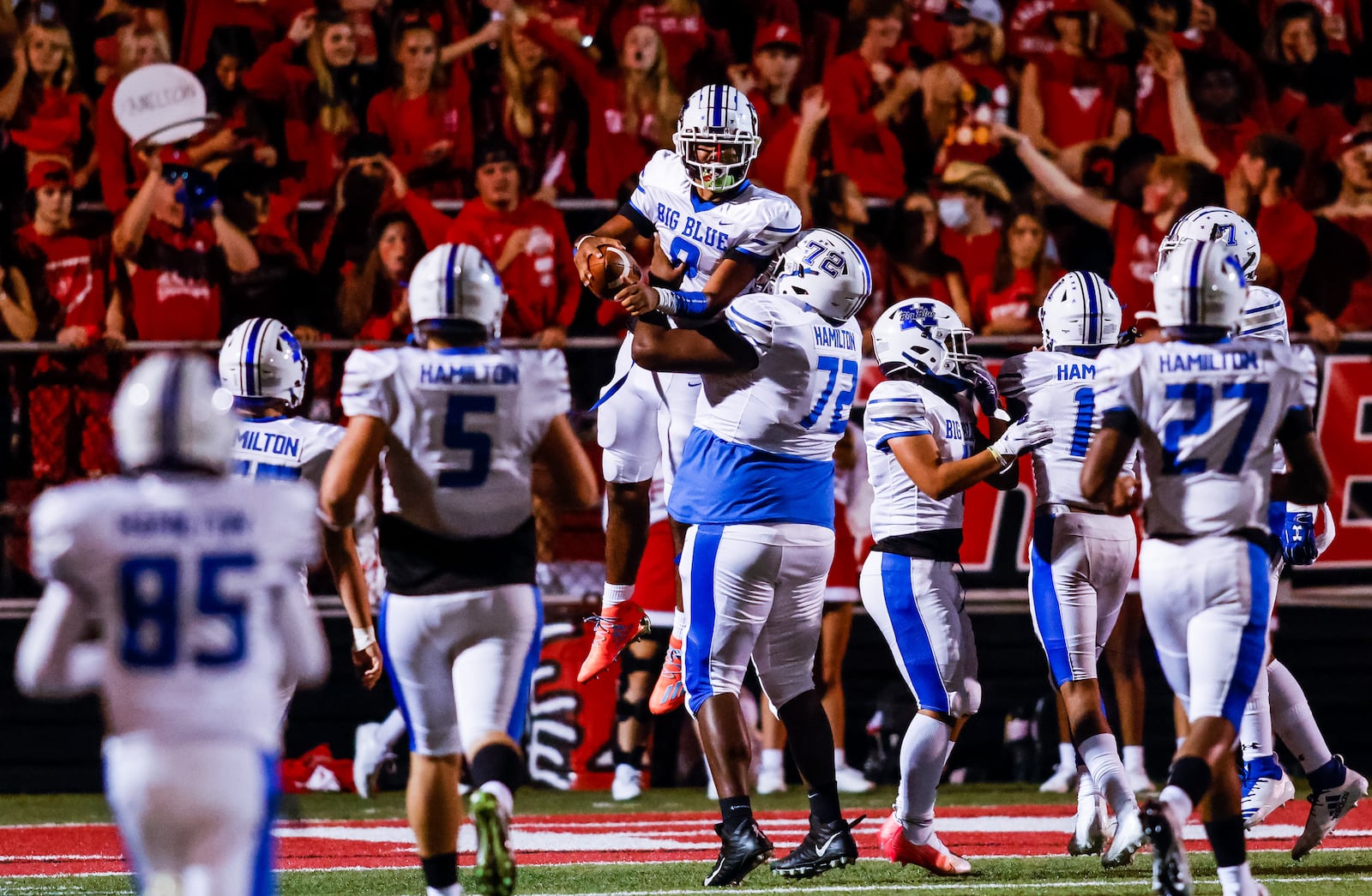 Hamilton's Kerry Ware (8) scores  touchdown and is lifted in celebration by offensive lineman Derrick Deaton (72) during their football game Friday, Sept. 24, 2021 at Fairfield Stadium. Fairfield won 28-14. NICK GRAHAM / STAFF