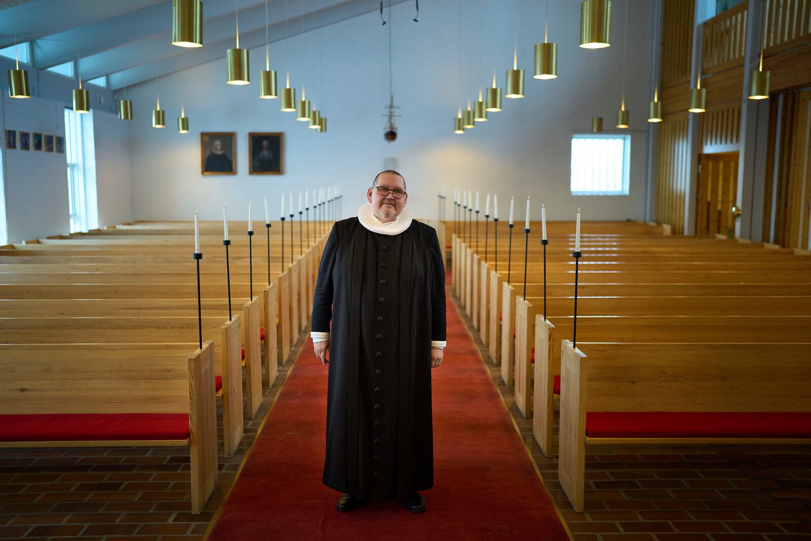 Pastor John Johansen, poses for a photo at the Hans Egede Church after leading a service in Nuuk, Greenland, Sunday, Feb. 16, 2025. (AP Photo/Emilio Morenatti)