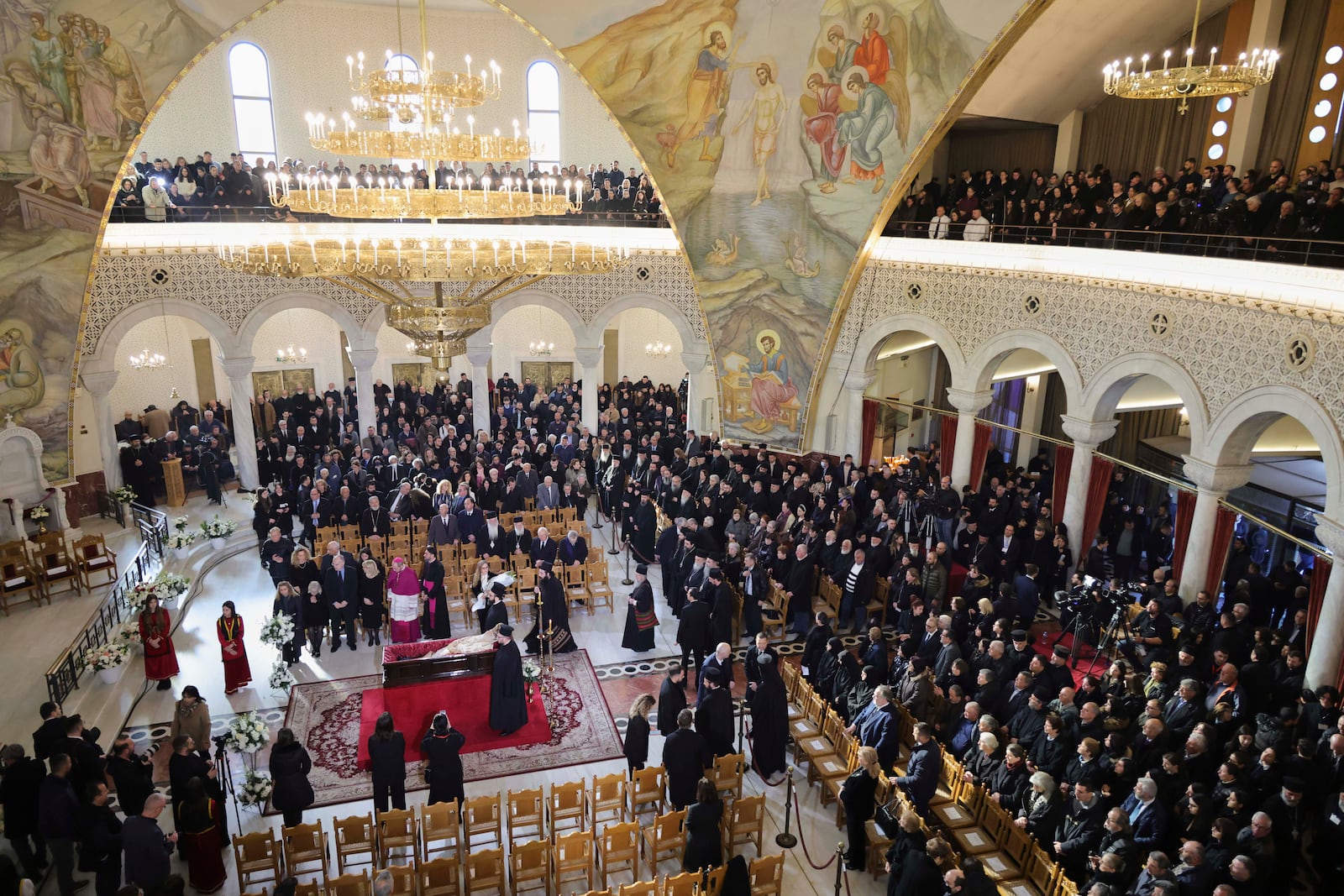 People pay their respects to the late Archbishop Anastasios of Tirana, Durres and All Albania during his funeral, inside the Cathedral of the Resurrection of Christ, in Tirana, Albania, Thursday, Jan. 30, 2025. (AP Photo/Vlasov Sulaj)