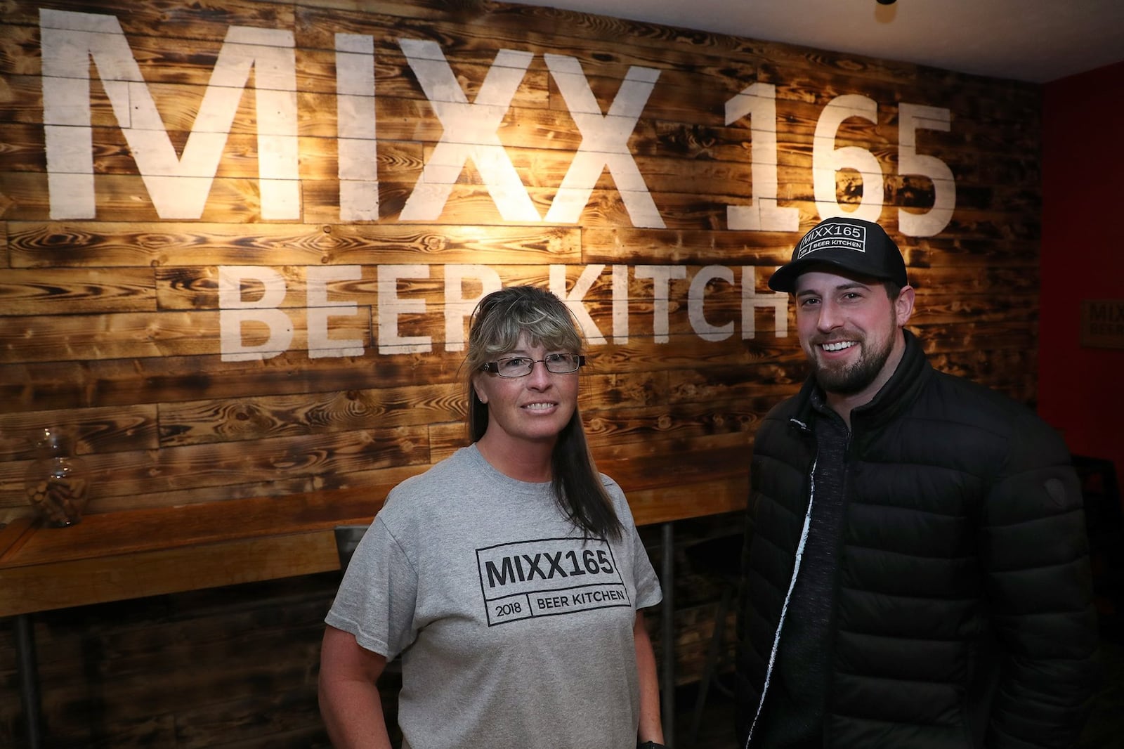 Jackie and Brad Winner, the owners of MIXX 165 Beer Kitchen in Mechanicsburg. BILL LACKEY/STAFF