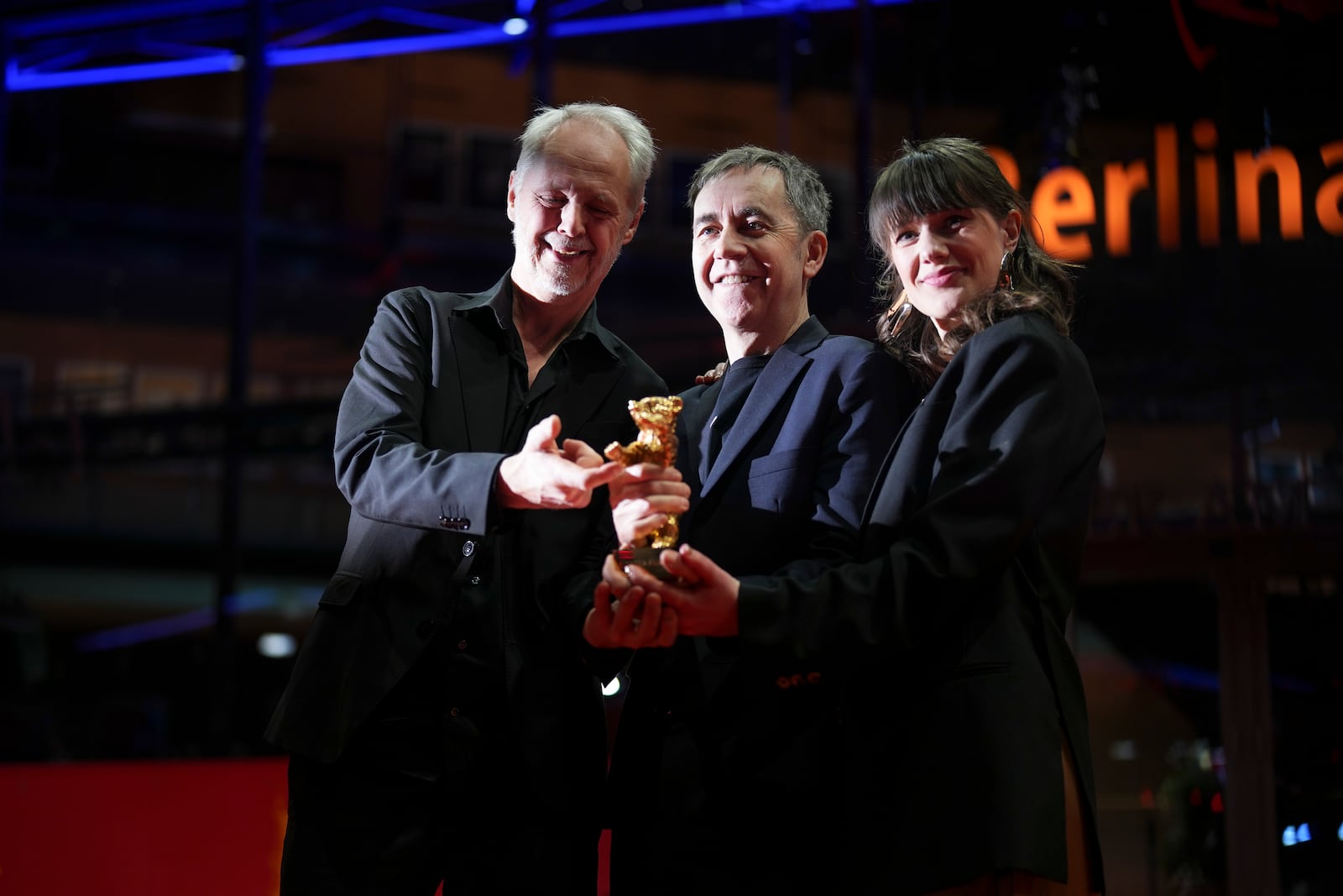 Yngve Saether, from left, Dag Johan Haugerud and Hege Hauff Hvattum, winners of the Golden Bear for best film for 'Dreams (Sex Love)', pose for photographers at the winners photo call during the International Film Festival, Berlinale, in Berlin, Saturday, Feb. 22, 2025. (Photo by Scott A Garfitt/Invision/AP).