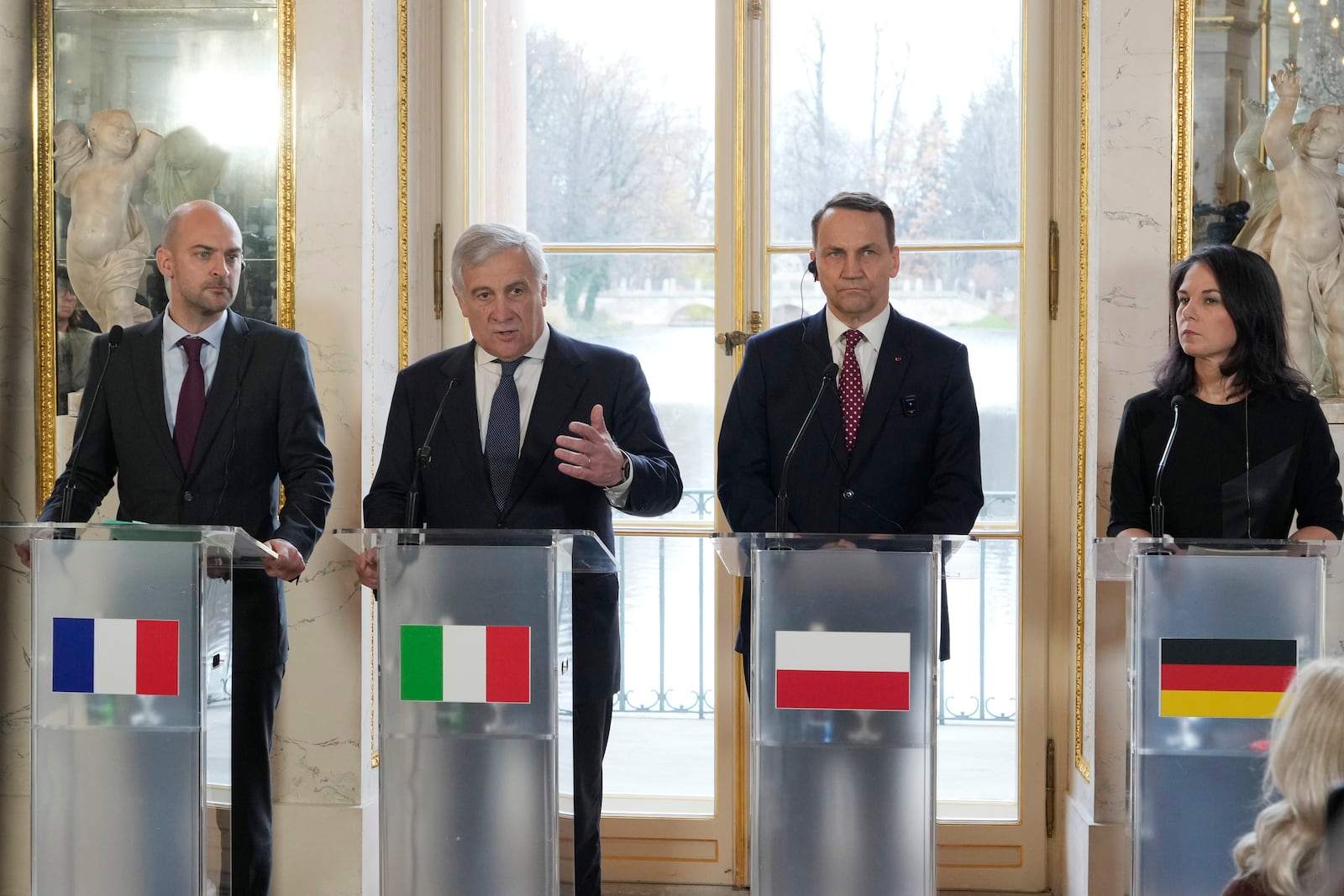 French Minister for Europe and Foreign Affairs Jean-Noel Barrot, left, Italian Foreign Minister Antonio Tajani, second left, Polish Foreign Minister Radoslaw Sikorski and German Foreign Minister Annalena Baerbock, right, attend a press conference as European foreign ministers meet in Warsaw, Poland, Tuesday, Nov. 19, 2024. (AP Photo/Czarek Sokolowski)