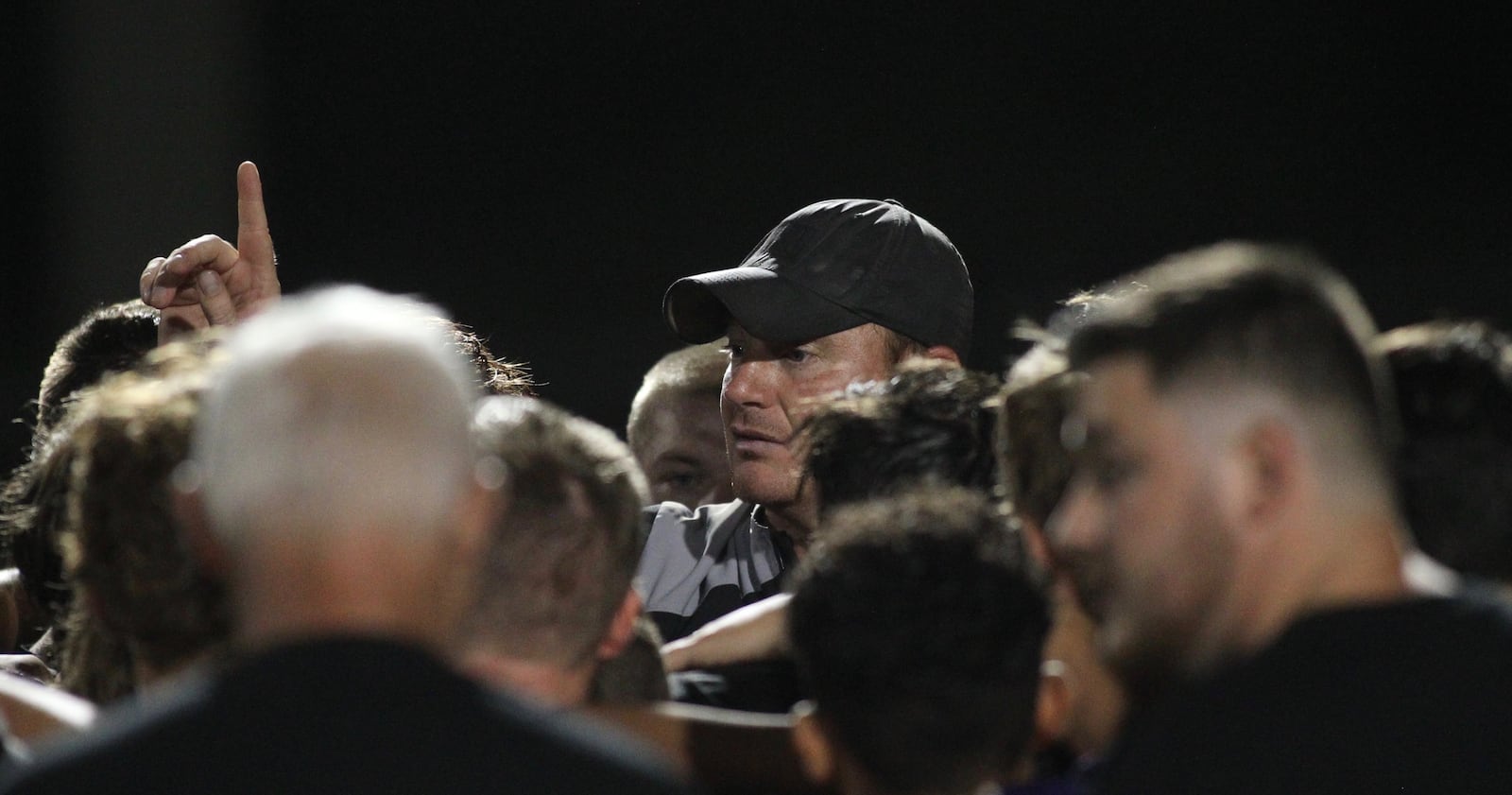 Mechanicsburg coach Kurt Forrest talks to his team after a victory against Kenton Ridge on Friday, Aug. 30, 2019, at Mechanicsburg.