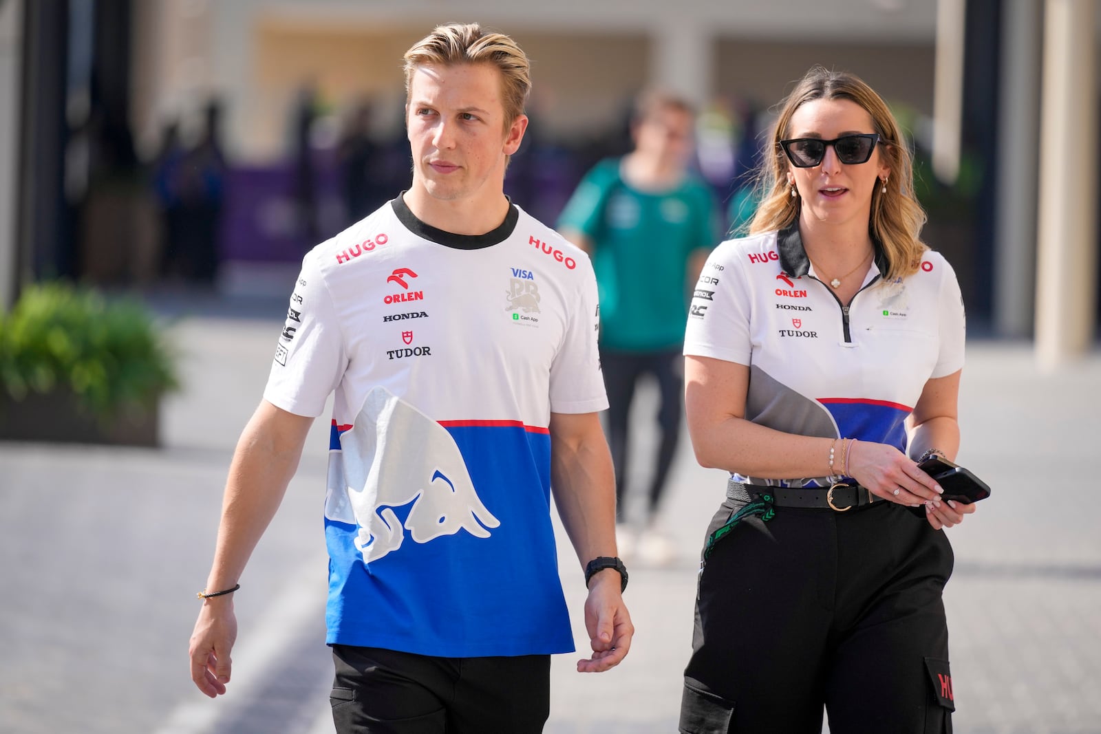 RB driver Liam Lawson of New Zealand walks through paddock ahead of the Formula One Abu Dhabi Grand Prix, at the Yas Marina Circuit in Abu Dhabi, UAE, Thursday, Dec. 5, 2024. (AP Photo/Darko Bandic)