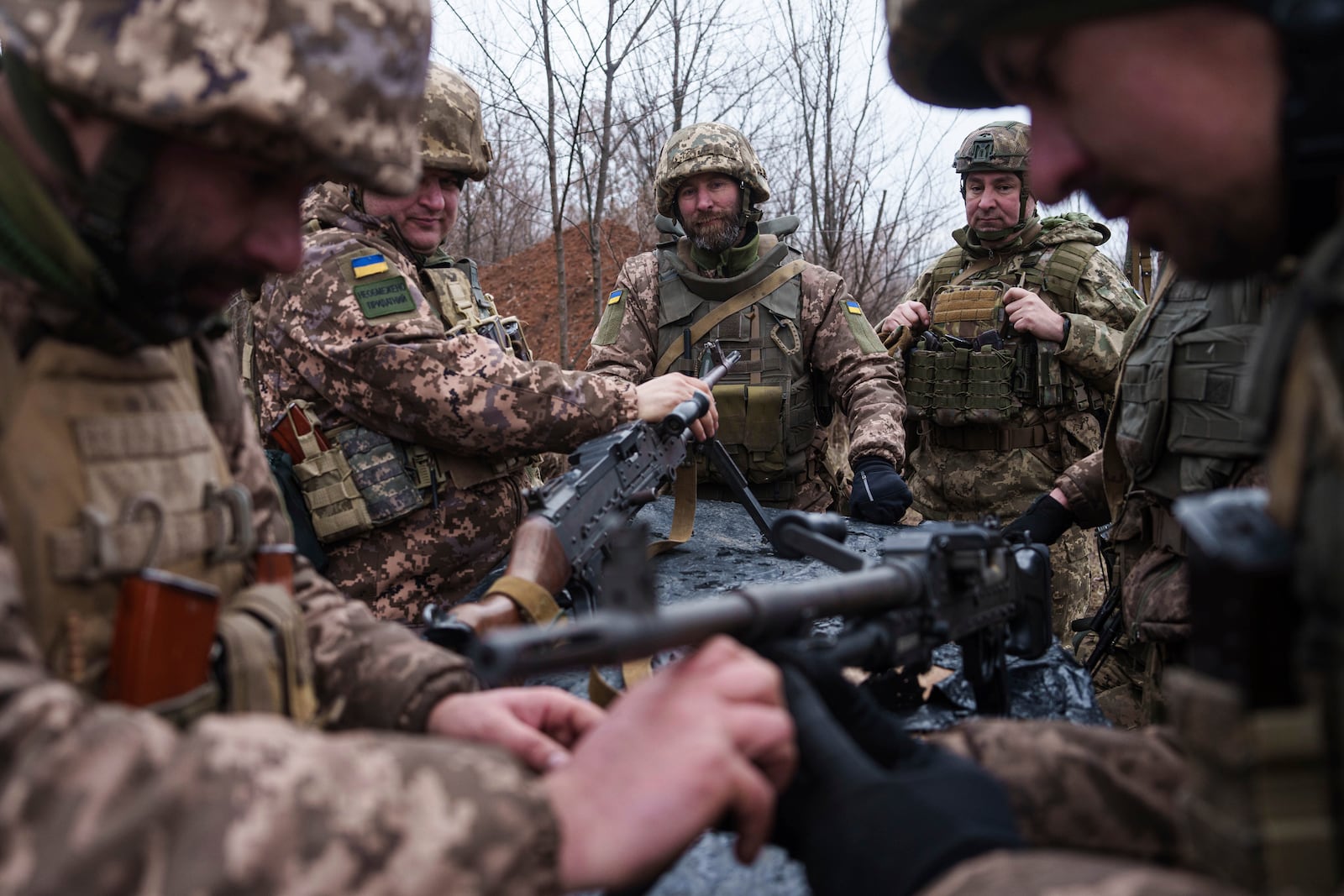 Ukrainian servicemen of 24th Mechanized brigade train at the polygon not far from frontline in Donetsk region, Ukraine, Tuesday, Jan. 21, 2025. (AP Photo/Evgeniy Maloletka)