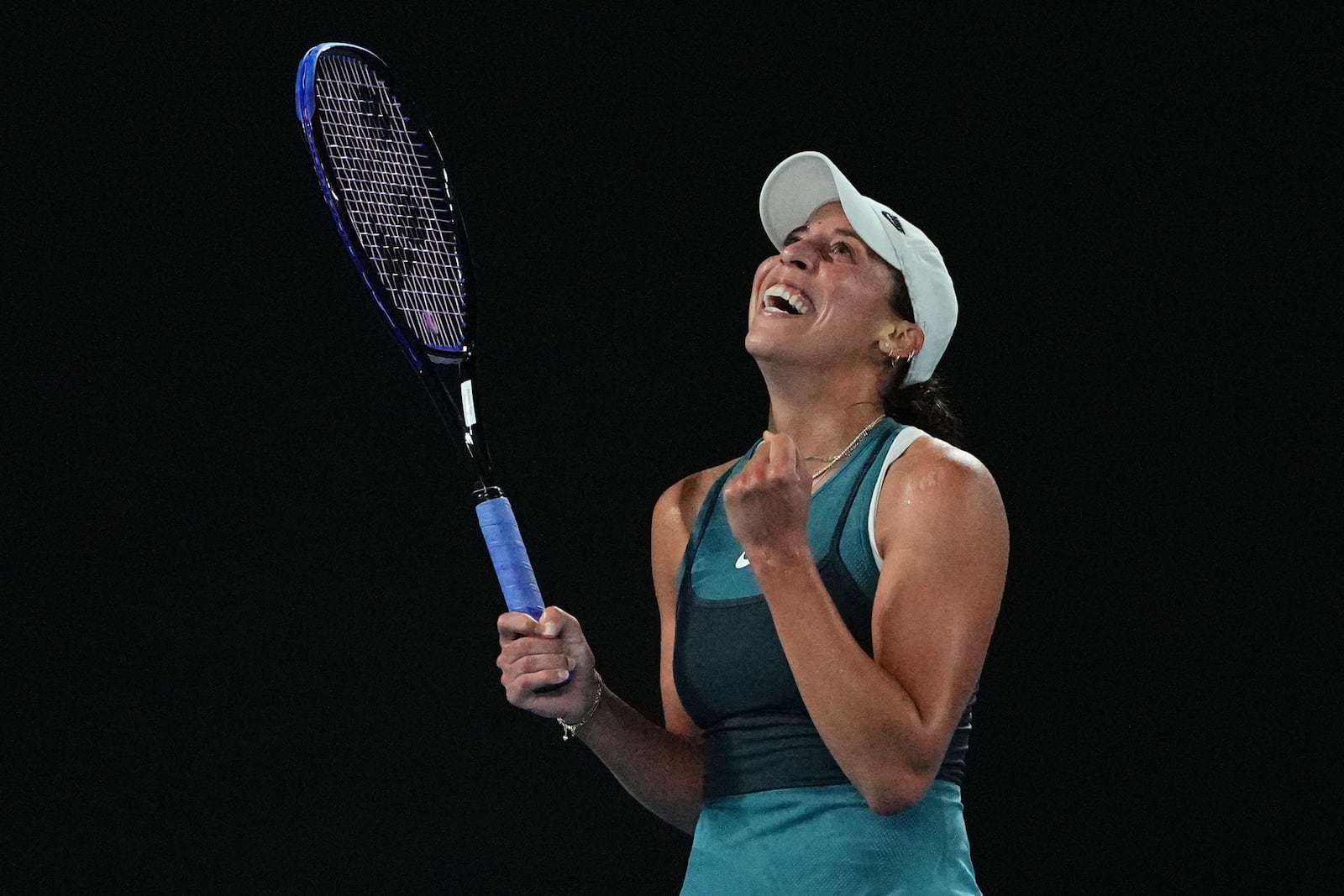 Madison Keys of the U.S. celebrates after defeating Iga Swiatek of Poland in their semifinal match at the Australian Open tennis championship in Melbourne, Australia, early Friday, Jan. 24, 2025. (AP Photo/Vincent Thian)