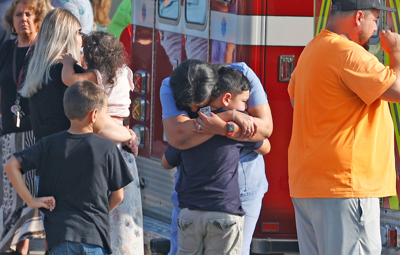 Family members are reunited with their children at the German Township Government Center following a Northwestern School District bus crash on State Route 41 Tuesday, August 22, 2023. BILL LACKEY/STAFF