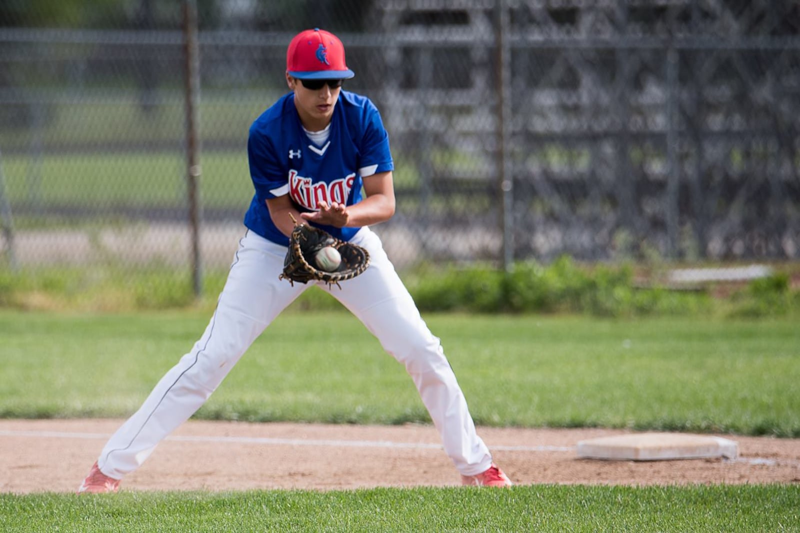 Bluffton University senior infielder and Kenton Ridge graduate Justin Maurer fields a groundball as a member of the Champion City Kings youth organization in 2017. John Coffman/CONTRIBUTED