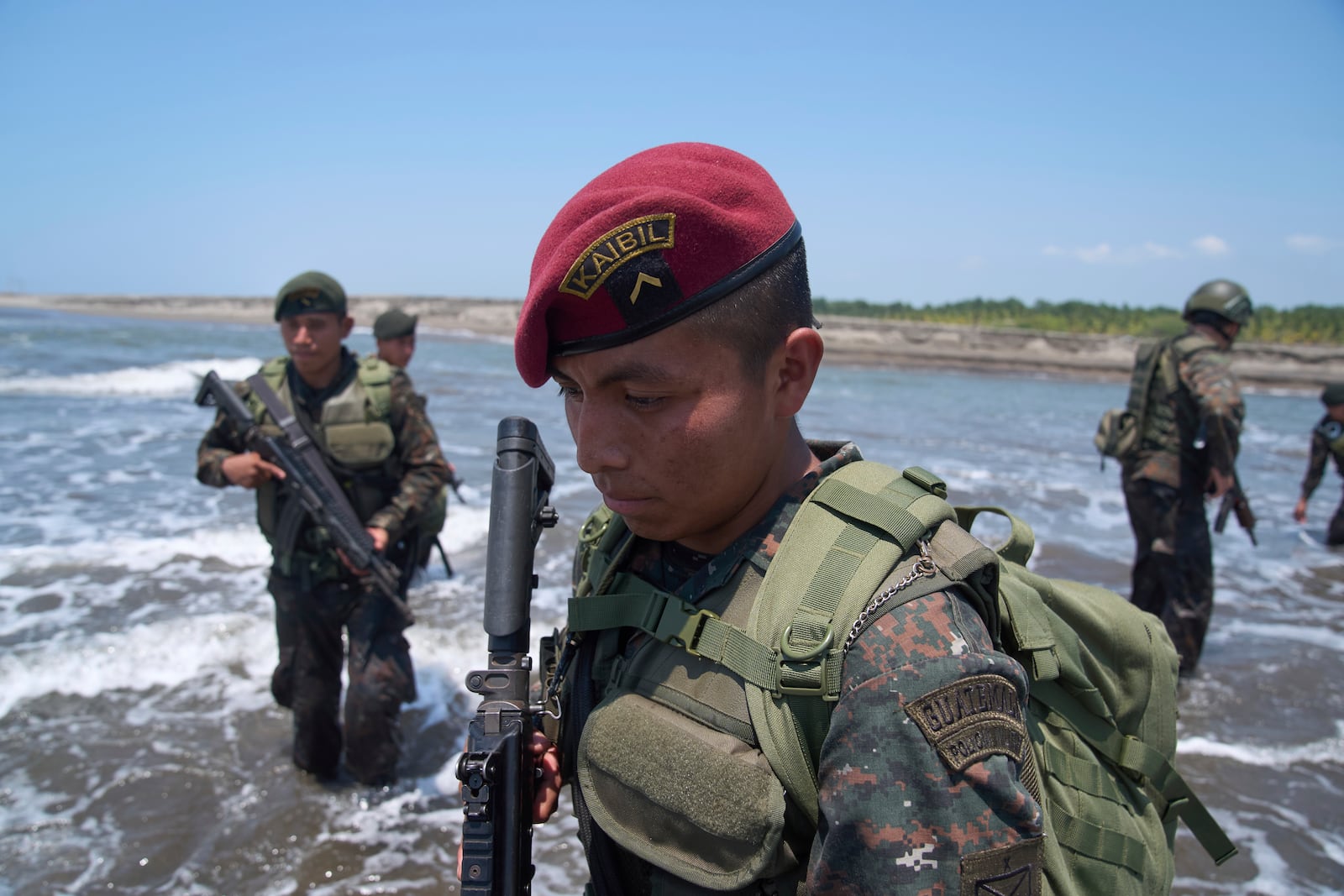 A member of the Kaibiles special force unit patrols the shared border with Mexico as part of the Ring of Fire operation, aiming to strengthen border control, at the mouth of the Suchiate River in Ocos, Guatemala, Thursday, March 13, 2025. (AP Photo/Moises Castillo)