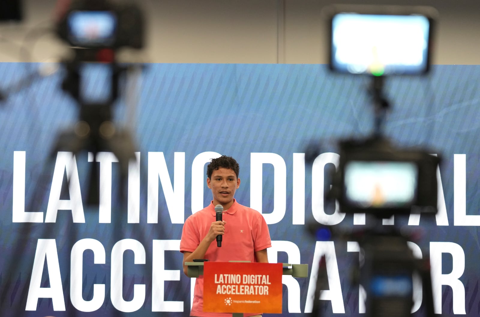 Dylan Pravia, a student at Florida International University, speaks during a Hispanic Federation event in Miami, Tuesday, Jan. 28, 2025, where the organization announced a new investment from a company, to help Latinos learn digital skills. (AP Photo/Lynne Sladky)