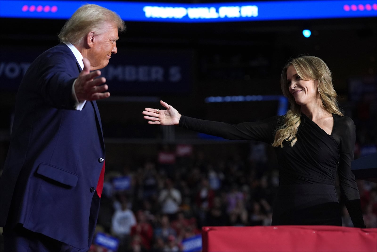 Republican presidential nominee former President Donald Trump greets Megyn Kelly at a campaign rally at PPG Paints Arena, Monday, Nov. 4, 2024, in Pittsburgh, Pa. (AP Photo/Evan Vucci)