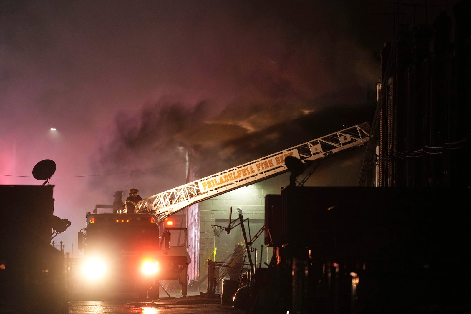 First responders work the scene after a small plane crashed in Philadelphia, Friday, Jan. 31, 2025. (AP Photo/Matt Rourke)