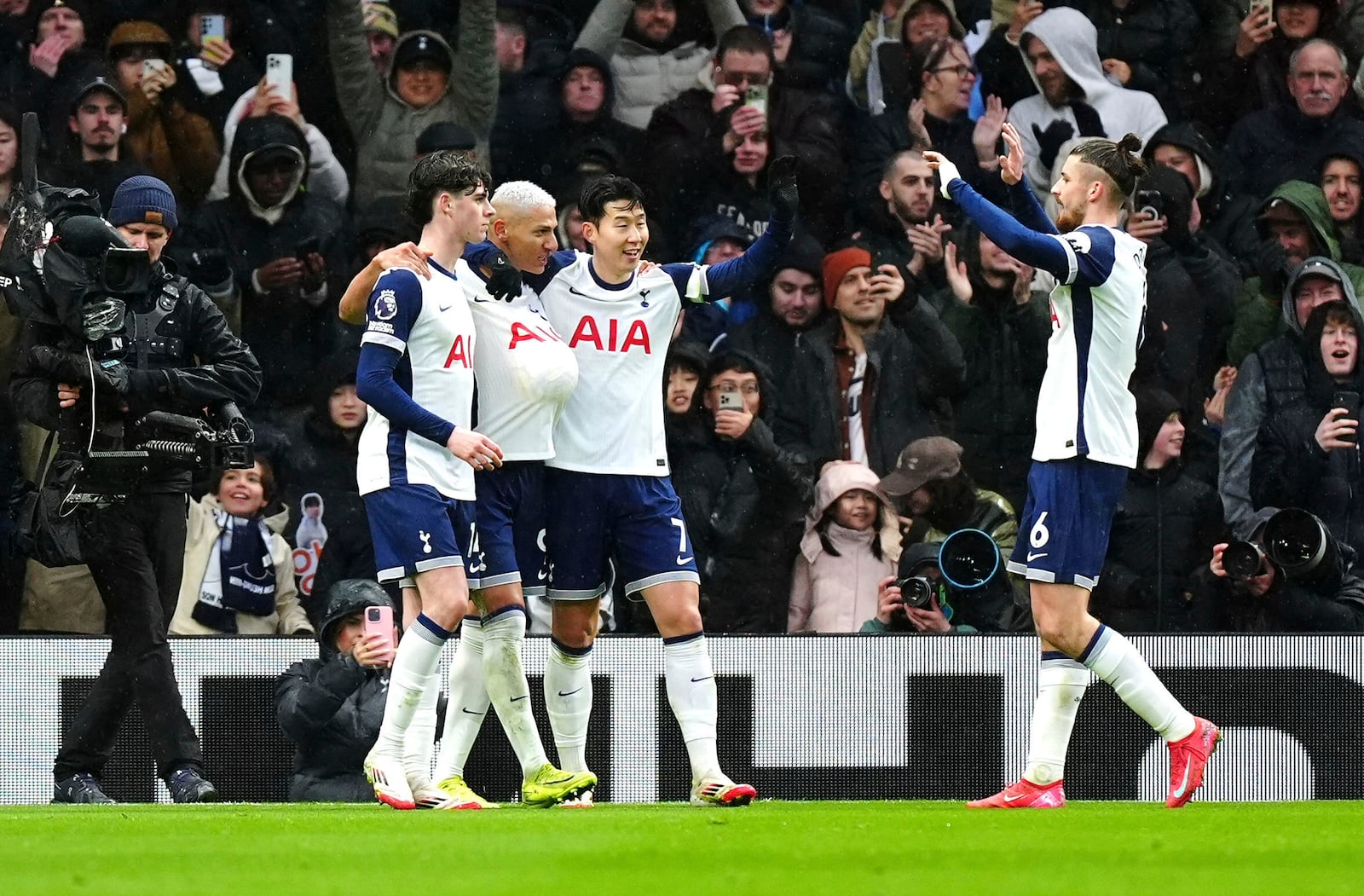 Tottenham Hotspur's Richarlison, second left, celebrates scoring his side's first goal of the game with teammates, during the English Premier League soccer match between Tottenham Hotspur and Leicester City, at Tottenham Hotspur Stadium, London, Sunday, Jan. 26, 2025. (Mike Egerton/PA via AP)