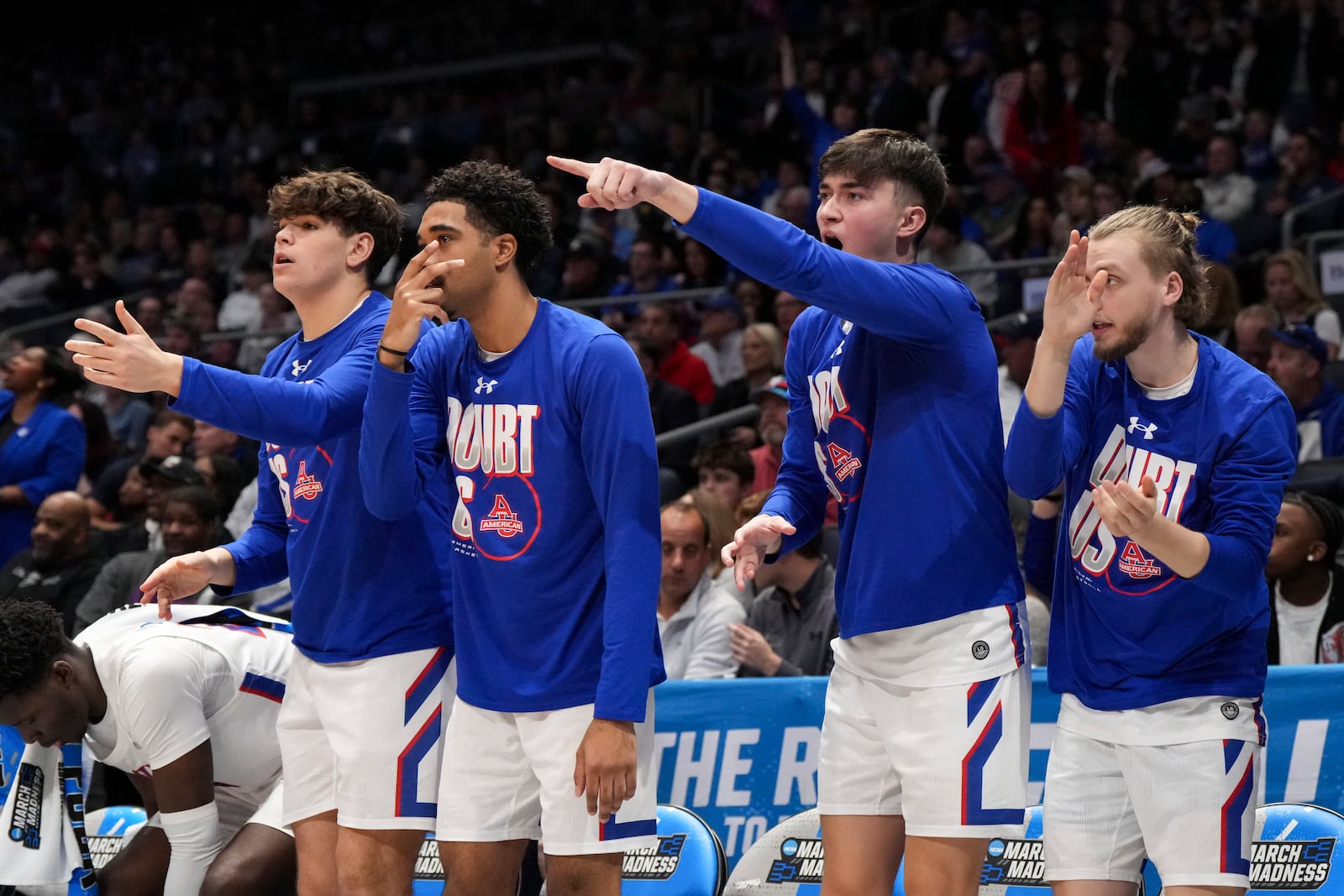 The American University bench reacts during the first half of a First Four college basketball game against Mount St. Mary's in the NCAA Tournament, Wednesday, March 19, 2025, in Dayton, Ohio. (AP Photo/Jeff Dean)