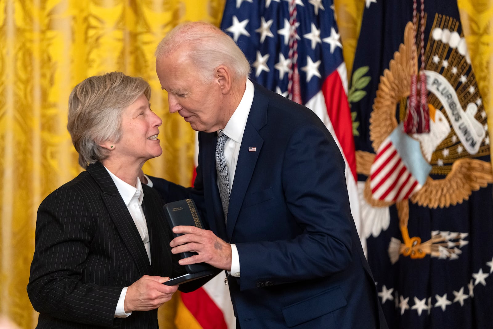 President Joe Biden awards the Presidential Citizens Medal to Mary Bonuato during a ceremony in the East Room at the White House, Thursday, Jan. 2, 2025, in Washington. (AP Photo/Mark Schiefelbein)