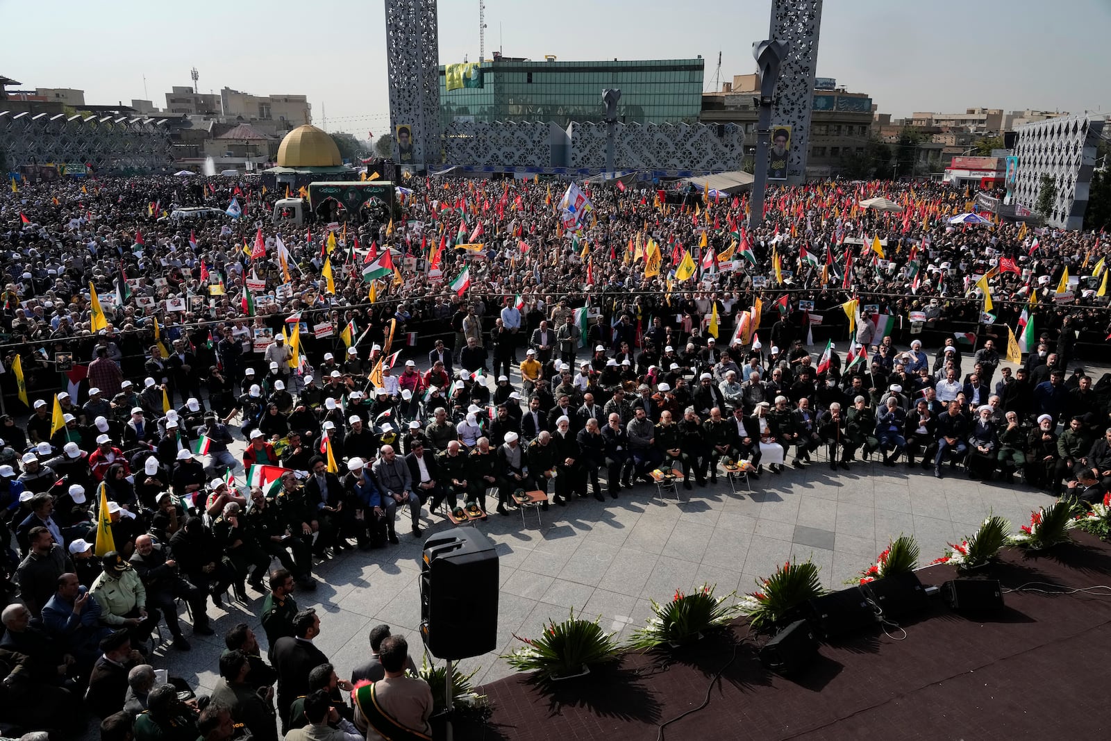 People and officials attend the funeral ceremony of the late Iranian Revolutionary Guard Gen. Abbas Nilforushan, who was killed in an Israeli airstrike in Beirut in late September, in Tehran, Iran, Tuesday, Oct. 15, 2024. (AP Photo/Vahid Salemi)