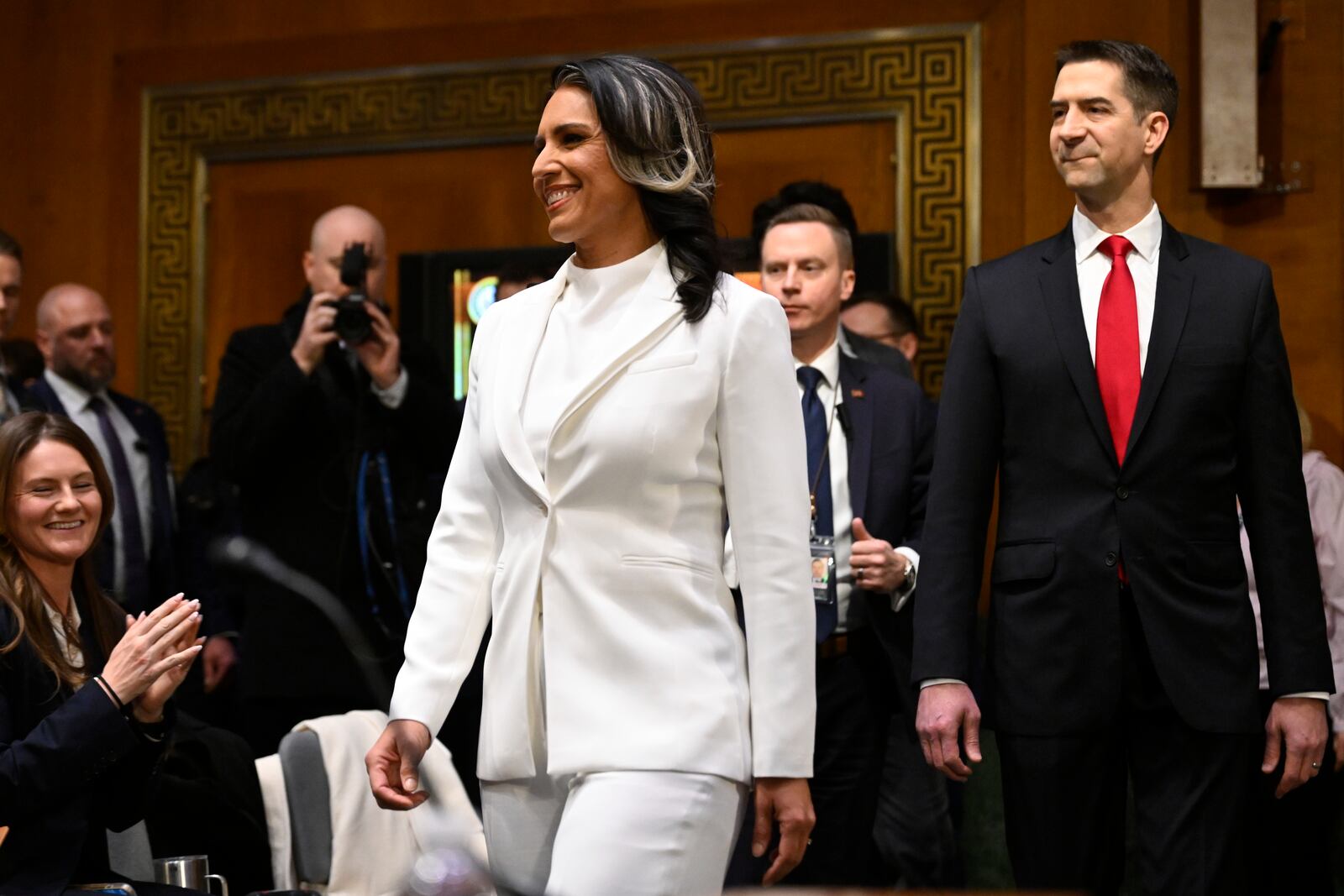 Tulsi Gabbard, President Donald Trump's choice to be the Director of National Intelligence, arrives with committee chairman Sen. Tom Cotton, r-Ark. to the Senate Intelligence Committee for her confirmation hearing on Capitol Hill Thursday, Jan. 30, 2025, in Washington. (AP Photo/John McDonnell)