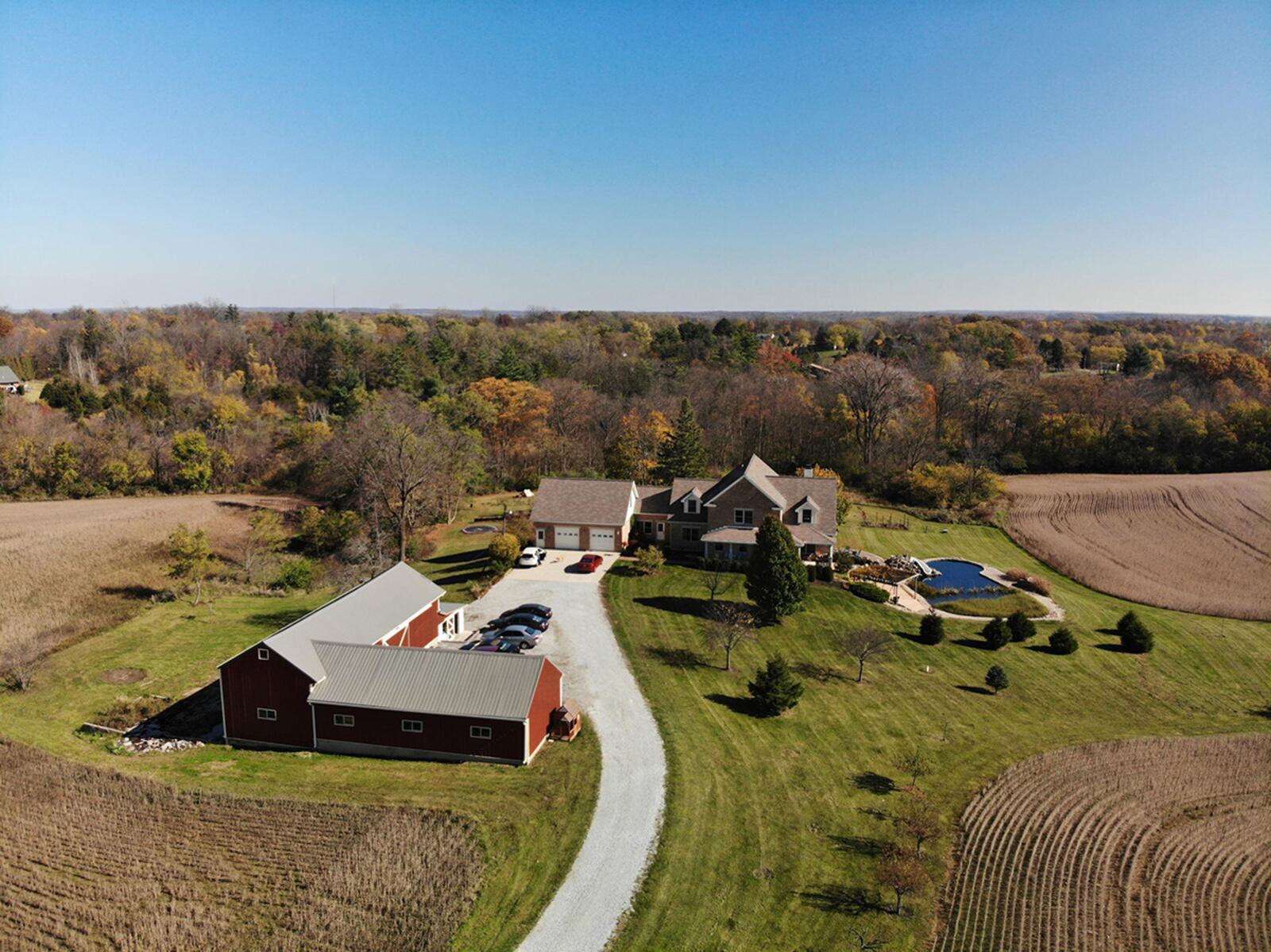 The 35-acre property is wooded with a large back yard and natural swimming pond. There is also a large area of farmland. An attached, 2-car garage and a detached, 3-car garage and barn are also features. CONTRIBUTED PHOTO