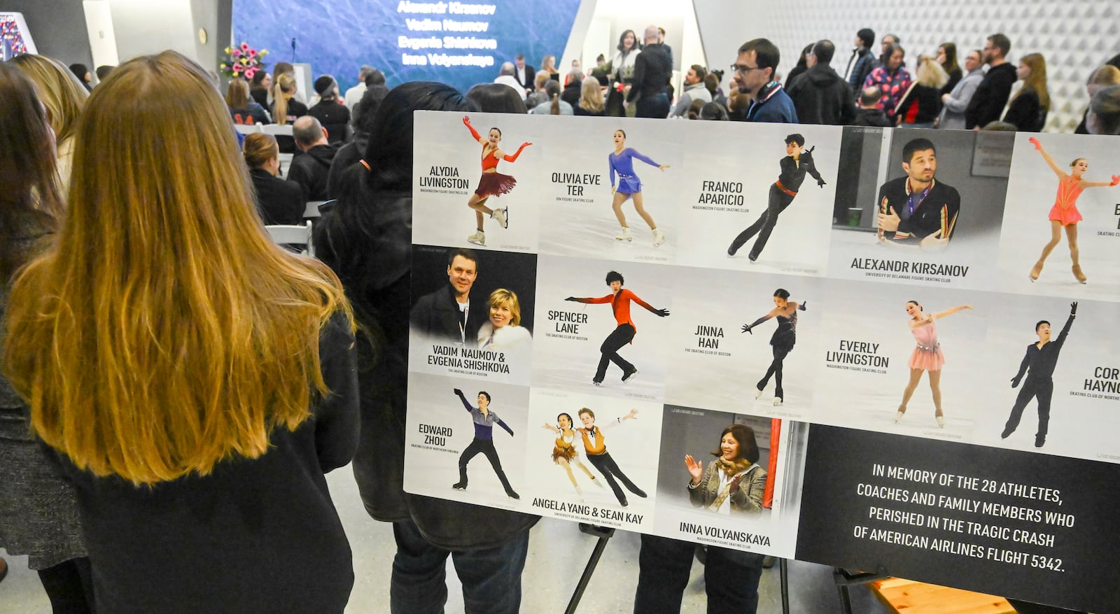 A vigil is held at the U.S. Olympic and Paralympic Museum for the 28 skaters, family members and coaches who died in last weeks plane crash in Washington, D.C., in Colorado Springs, Colo., Monday, Feb. 3, 2025. (Jerilee Bennett/The Gazette via AP)