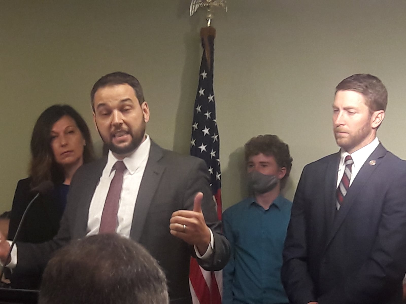 Aaron Baer, president of the Center for Christian Virtue, touts HB 290 on Oct. 6, 2021. Behind him are bill sponsors Rep. Marilyn John (left) and Rep. Riordan McClain.