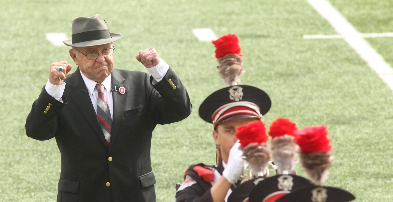 Former Ohio State coach Earle Bruce reacts as he's honored by dotting the I in Script Ohio before a game against Rutgers on Saturday, Oct. 1, 2016, at Ohio Stadium in Columbus. David Jablonski/Staff