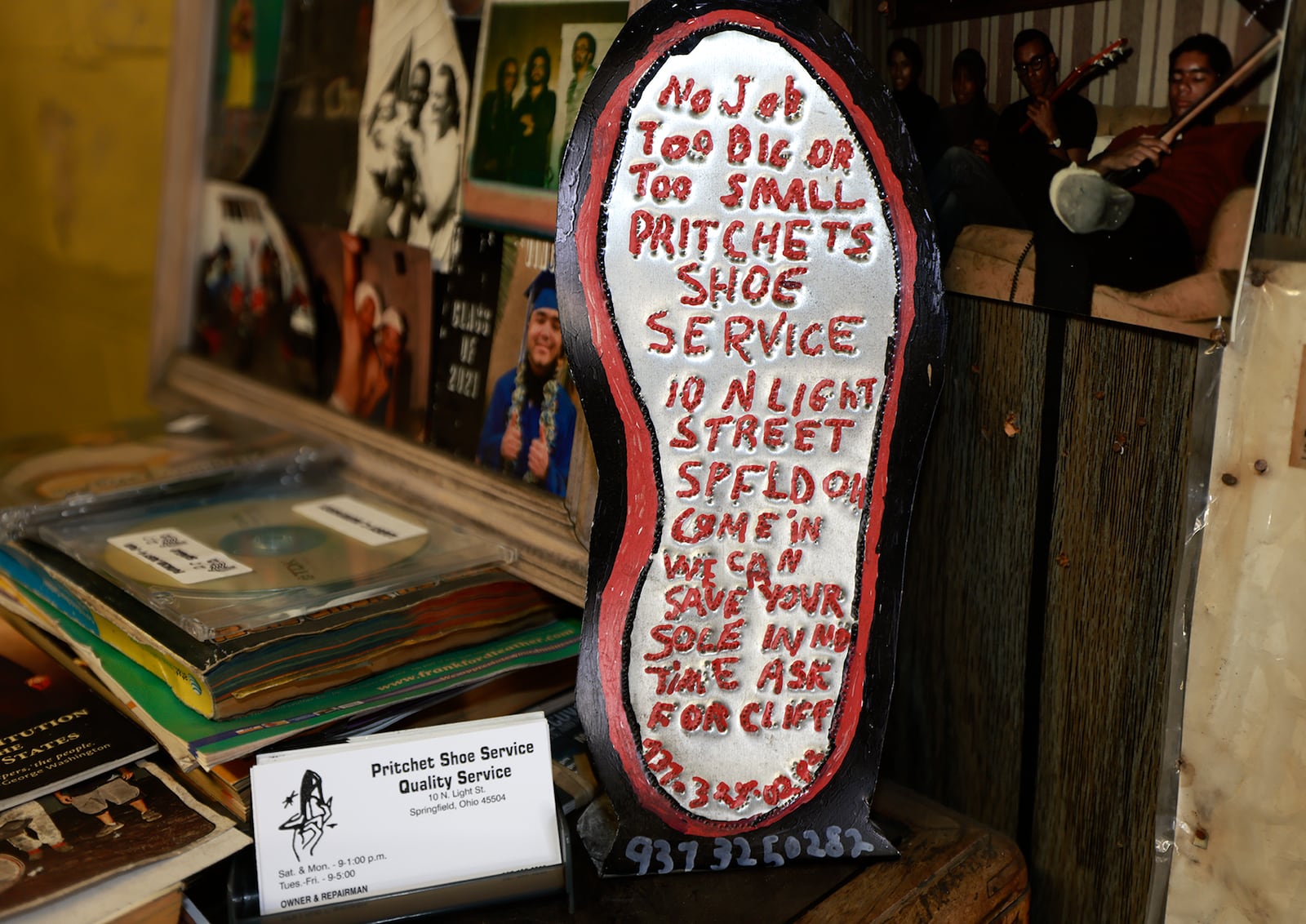 A sign, made by a customer, sits on the counter at Pritchet Show Service. BILL LACKEY/STAFF