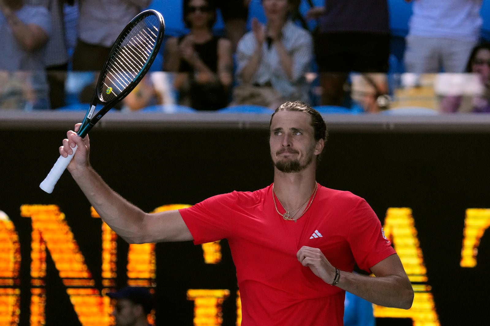 Alexander Zverev of Germany waves after defeating Jacob Fearnley of Britain in their third round match at the Australian Open tennis championship in Melbourne, Australia, Friday, Jan. 17, 2025. (AP Photo/Vincent Thian)