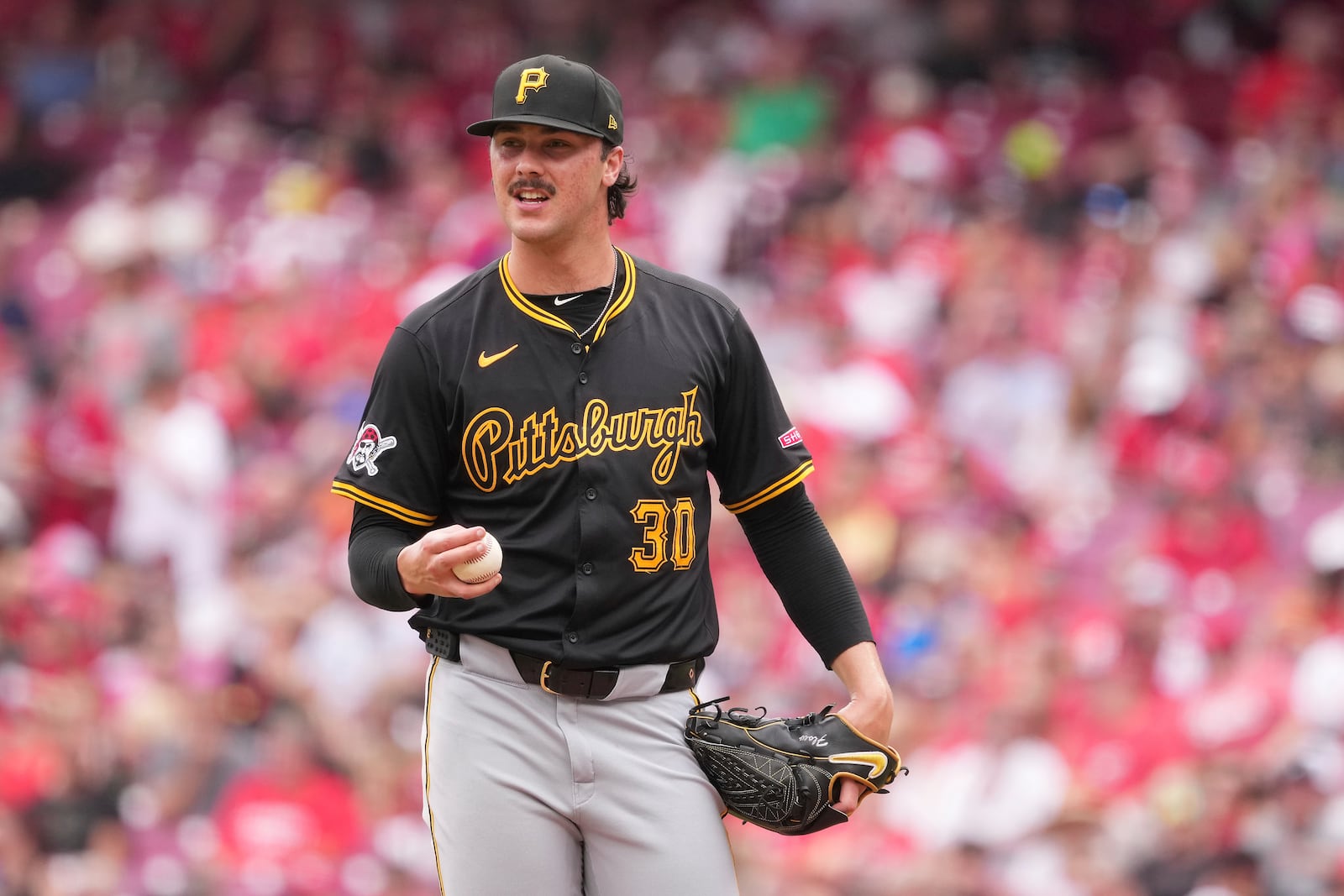 FILE - Pittsburgh Pirates' Paul Skenes resets on the mound before delivering a pitch during the fourth inning of a baseball game against the Cincinnati Reds, Sept. 22, 2024, in Cincinnati. (AP Photo/Kareem Elgazzar, File)