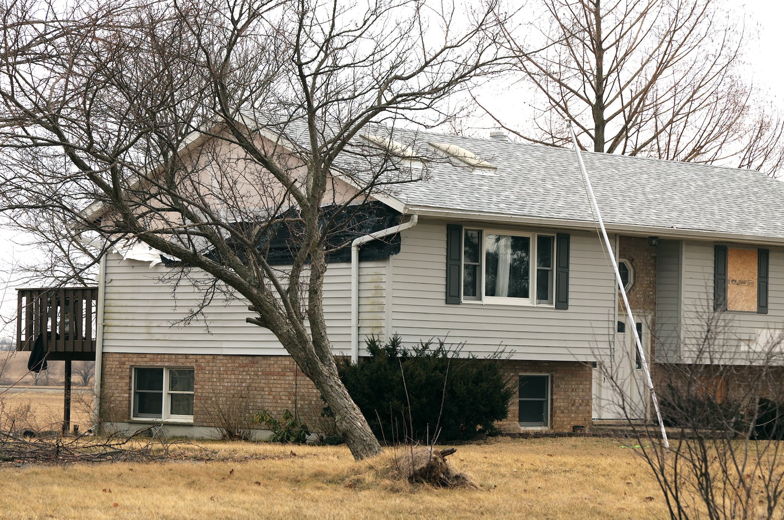 A house on Ridge Road is still damaged a year after it was hit by a tornado. BILL LACKEY/STAFF