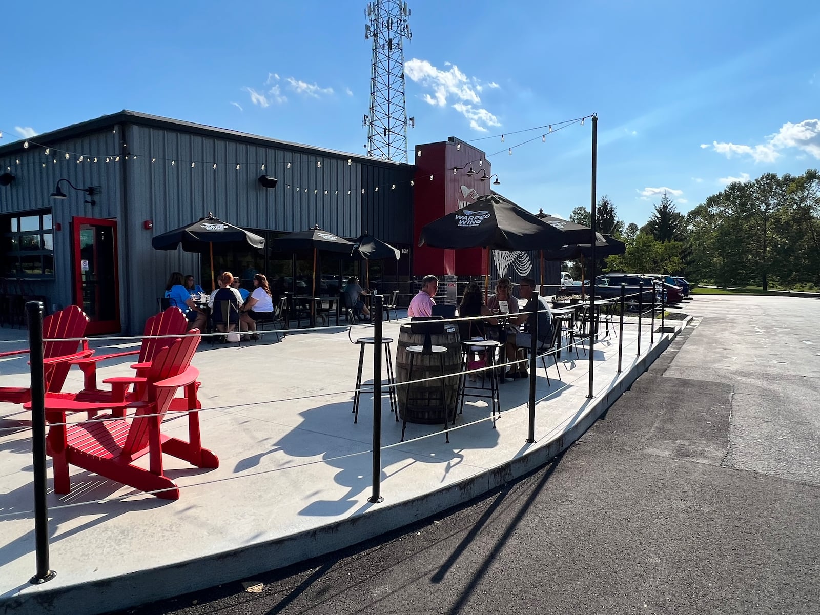 The patio at Warped Wing Brewery & Smokery in Huber Heights is spacious and dog-friendly. ALEXIS LARSEN/CONTRIBUTOR