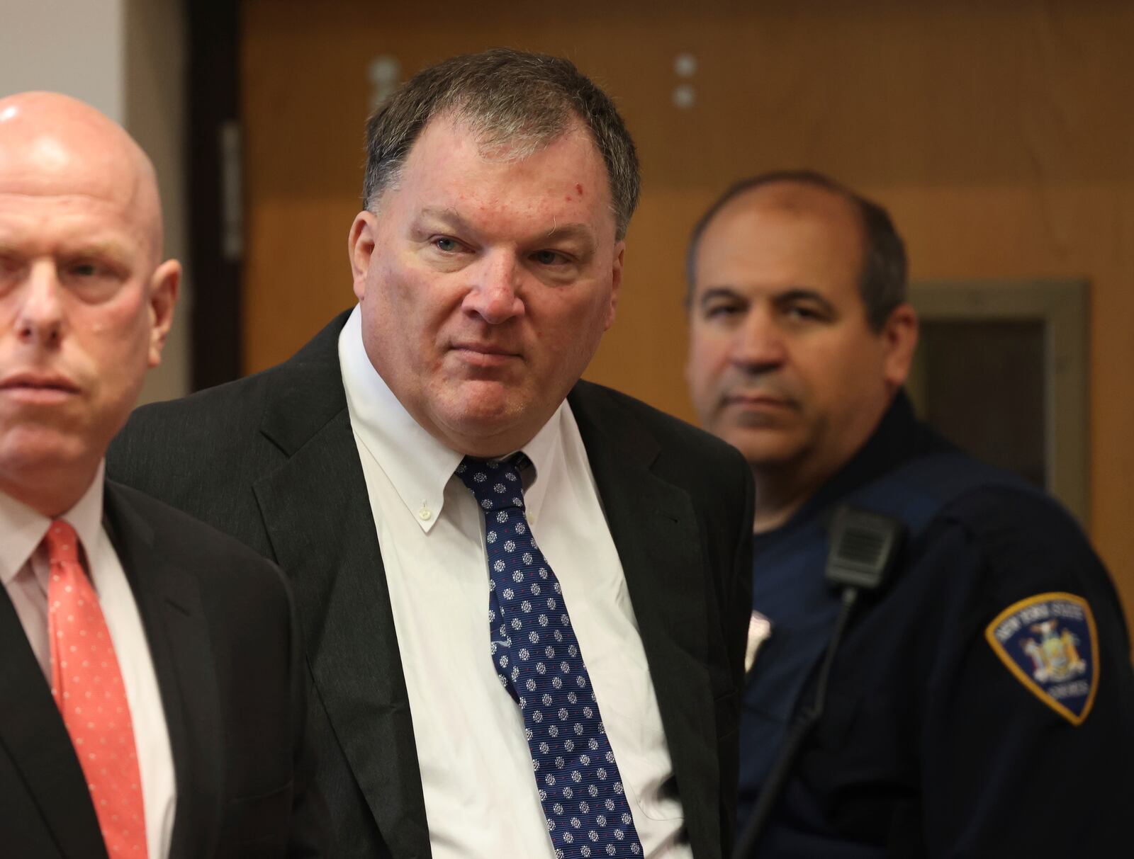 FILE - Rex Heuermann, center, charged in the Gilgo Beach serial killings on Long Island, appears for a hearing, Tuesday, July 30, 2024, at Suffolk County Court in Riverhead, N.Y. (James Carbone/Newsday via AP, File, Pool)