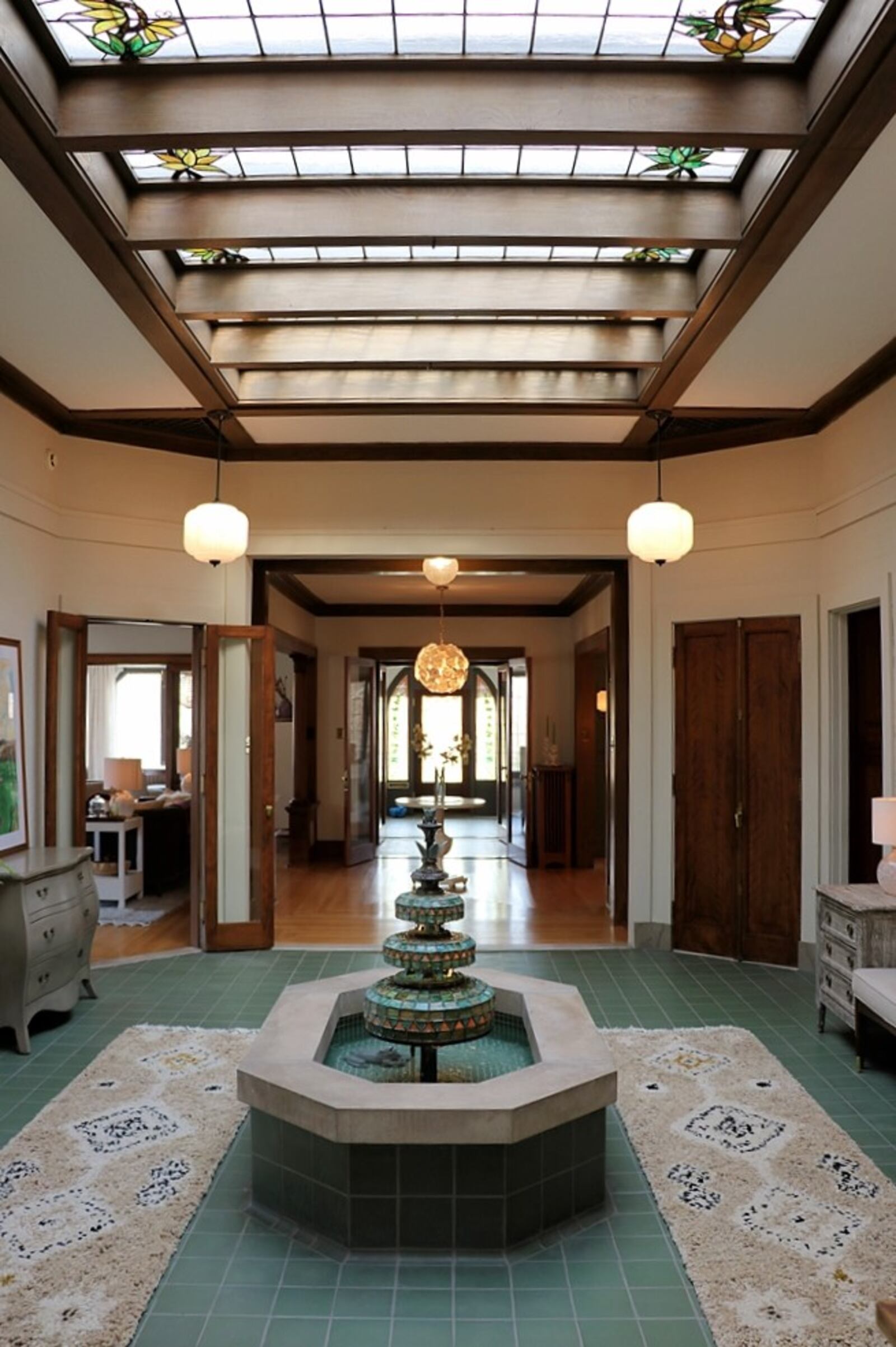 The atrium fountain and many windows add to the home's luxury and handcrafted nature.