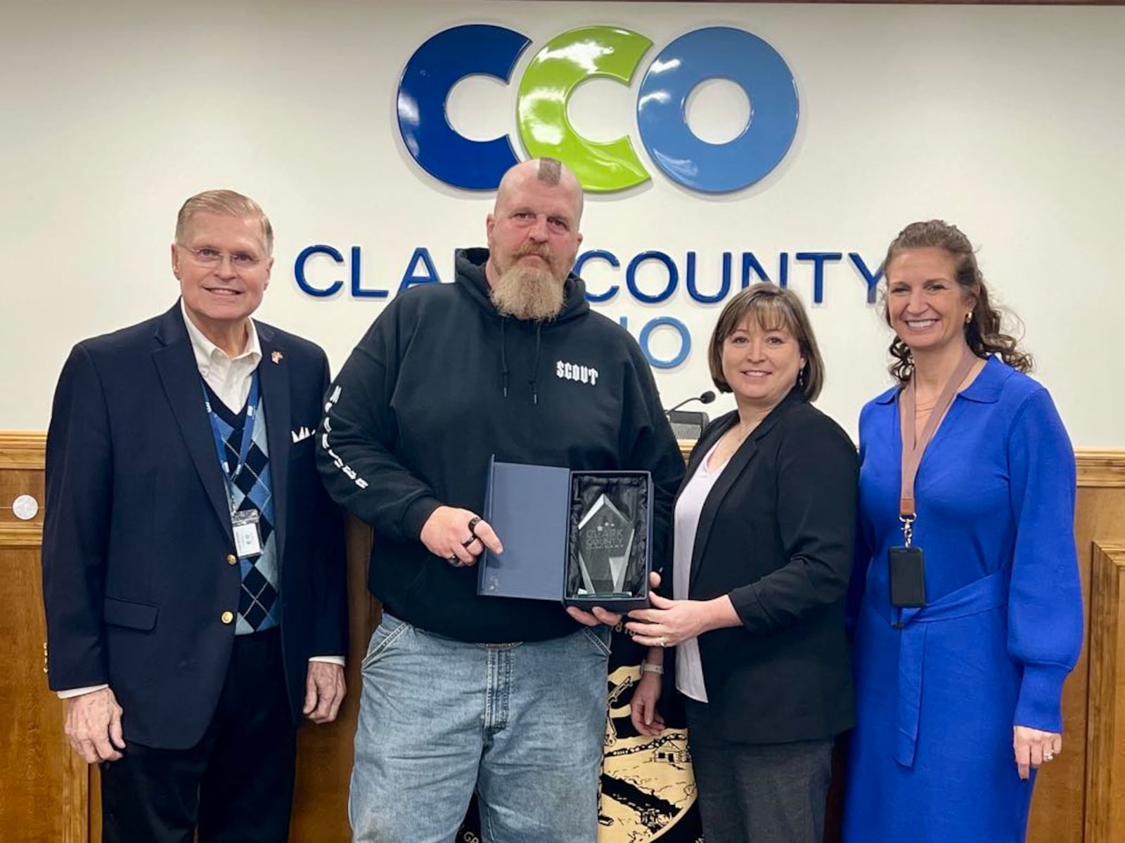 Rex Fent (second from left) poses with (from left to right) Commissioners Lowell McGlothin, Sasha Rittenhouse and Melanie Flax Wilt after being honored with a luminary award Friday, Dec. 27, 2024. CONTRIBUTED