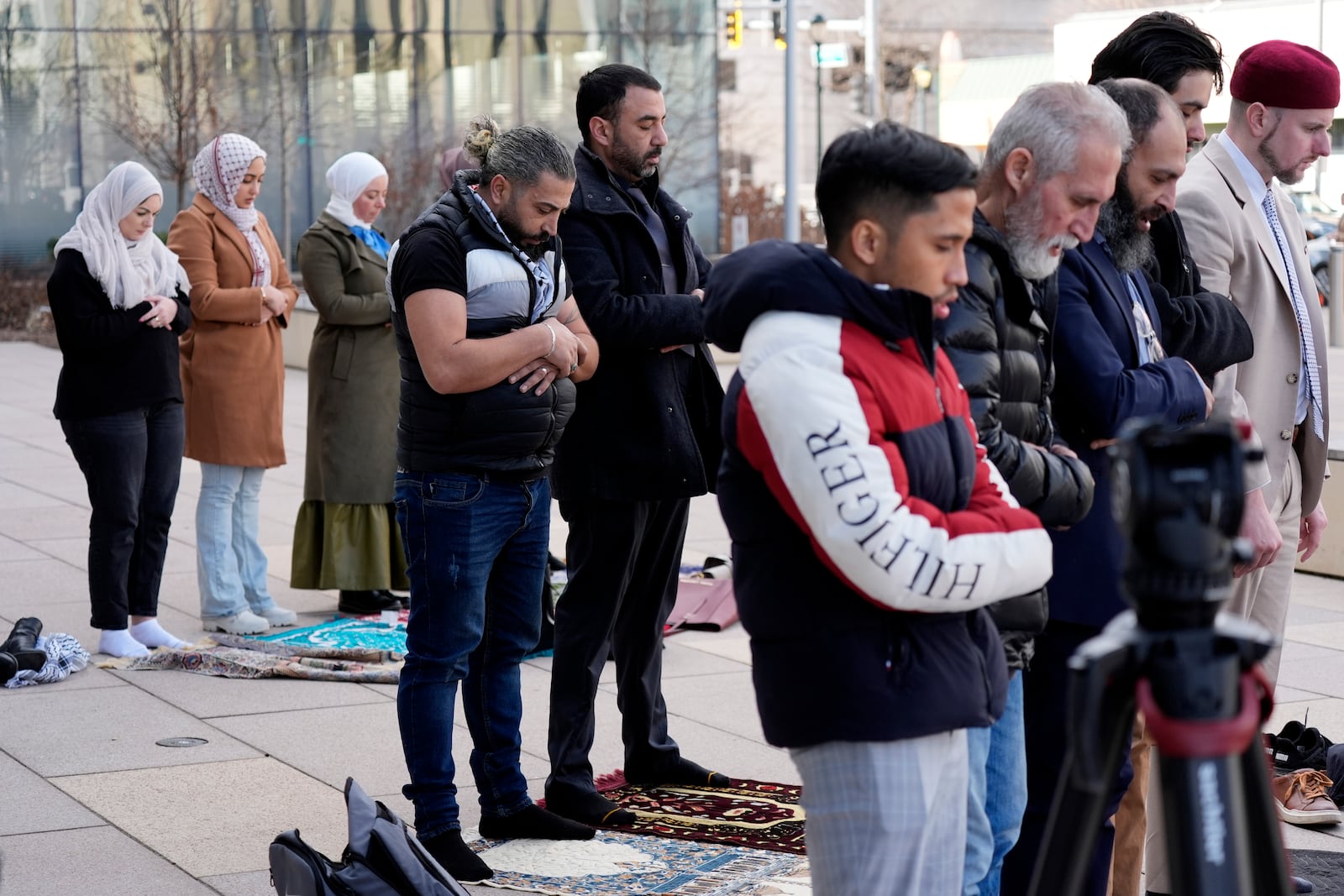 Odai Alfayoumi, father of 6-year-old Palestinian boy Wadee Alfayoumi, prays with Communications Coordinator of Council on American-Islamic Relations members, outside the Will County Courthouse where a jury found defendant Joseph Czuba found guilty of murder and hate crime charges, Friday, Feb. 28, 2025, in Joliet, Ill. (AP Photo/Nam Y. Huh)