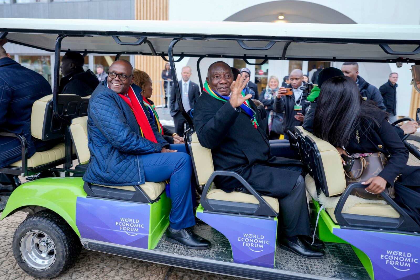 Cyril Ramaphosa, President of South Africa, right uses a shuttle the Annual Meeting of World Economic Forum in Davos, Switzerland, Wednesday, Jan. 22, 2025. (AP Photo/Markus Schreiber)