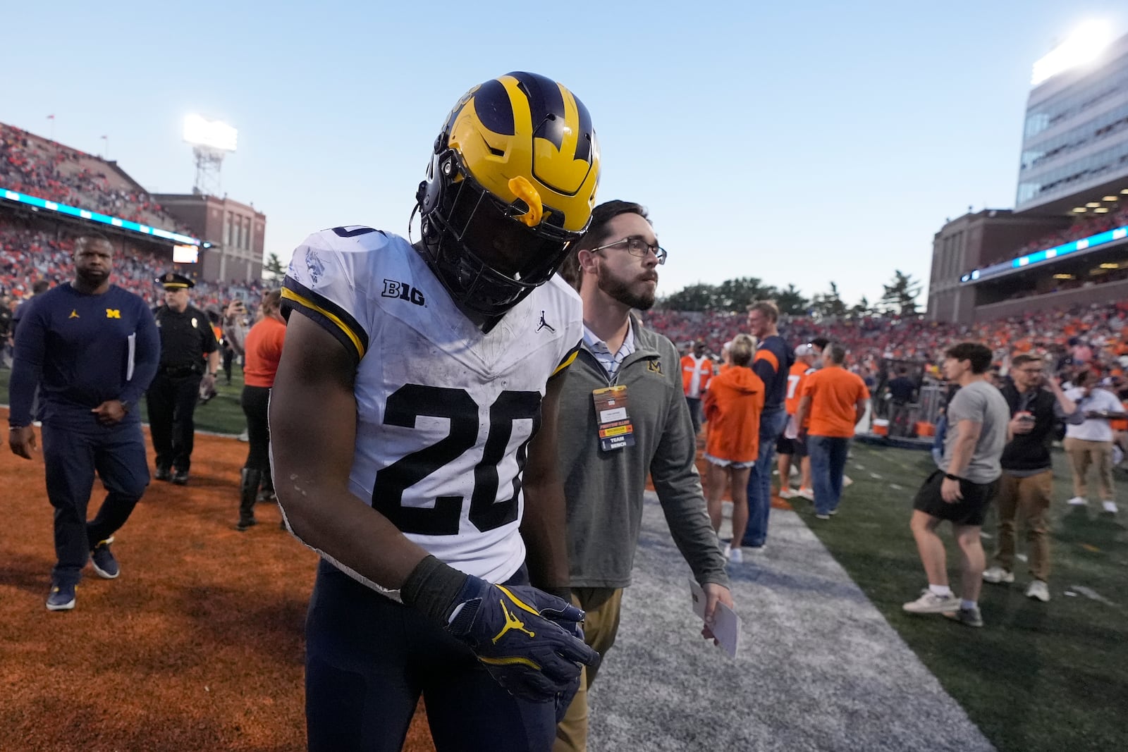 Michigan running back Kalel Mullings walks off the field after the team's 21-7 loss to Illinois in an NCAA college football game Saturday, Oct. 19, 2024, in Champaign, Ill. (AP Photo/Charles Rex Arbogast)