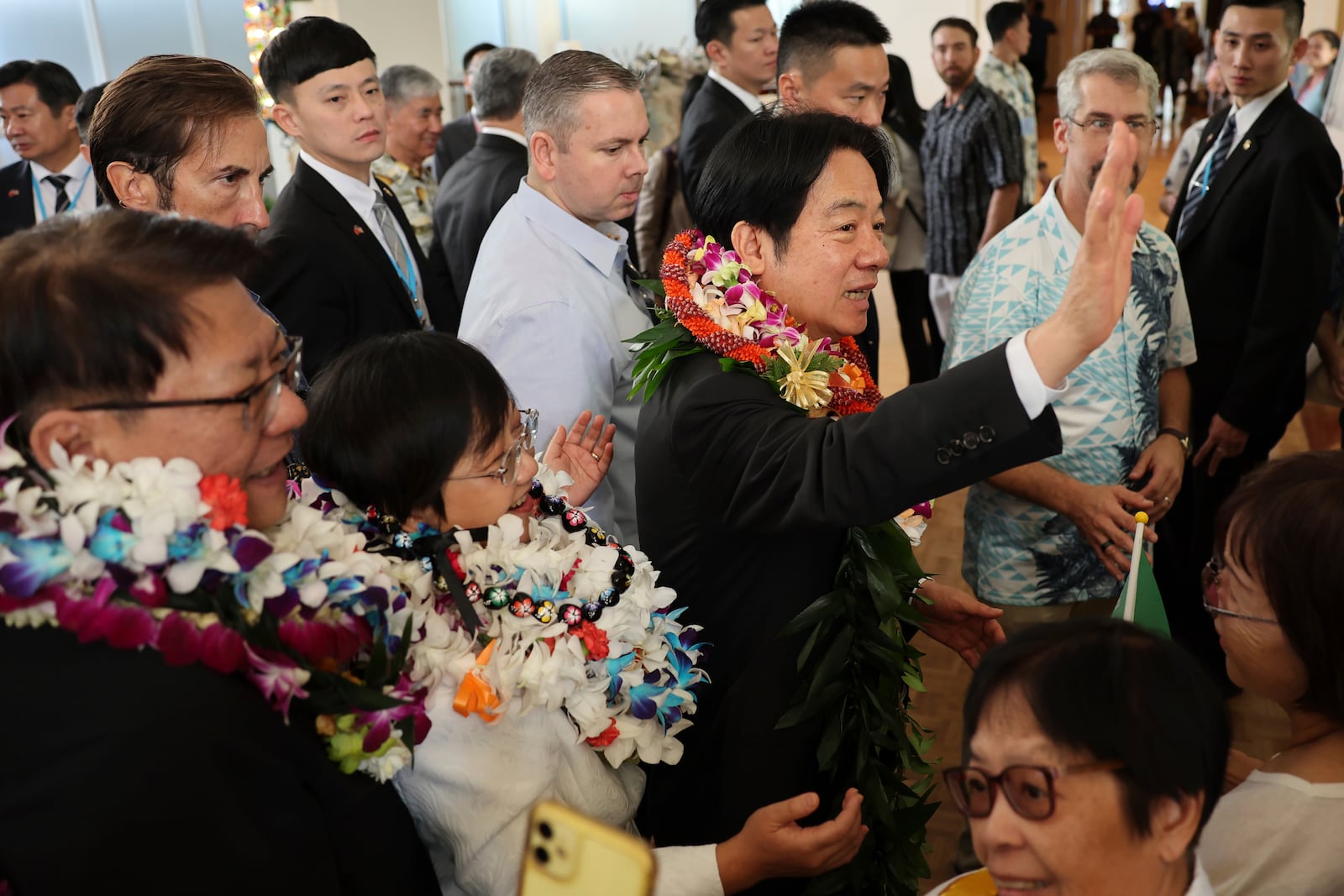 Taiwan President Lai Ching-te greets people at the Kahala Hotel and Resort Saturday, Nov. 30, 2024 in Honolulu. (AP Photo/Marco Garcia)