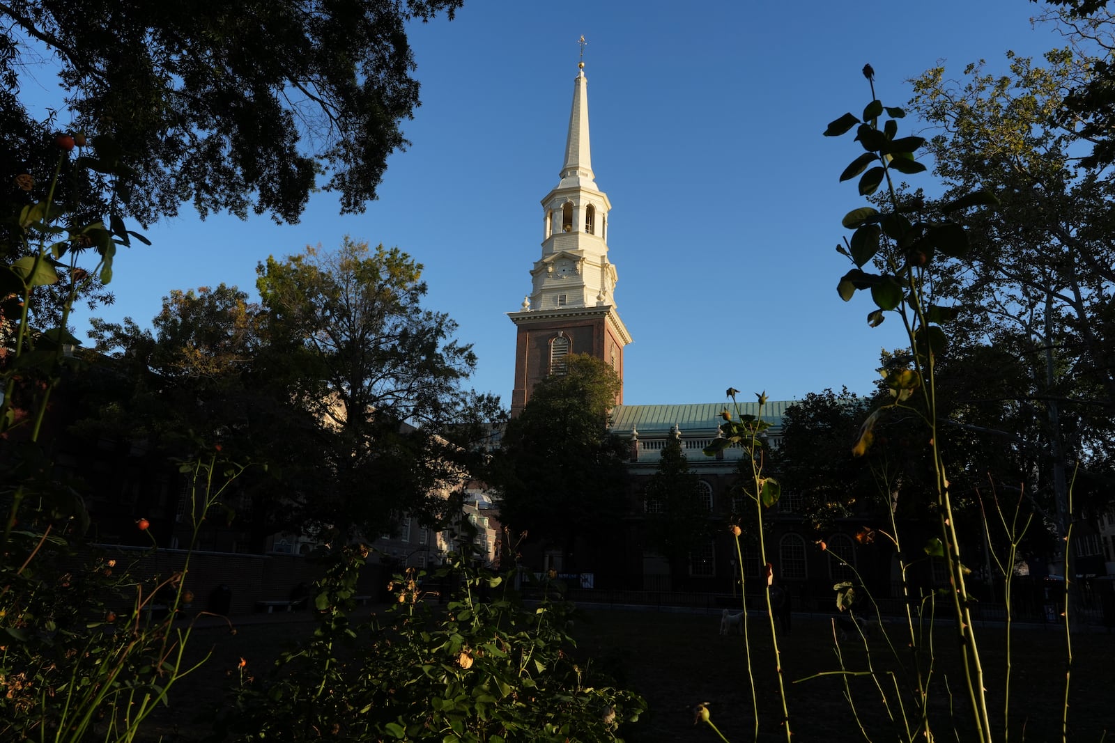 The Christ Church steeple, financed and built through a lottery spearheaded by Benjamin Franklin, rises into the sky in Philadelphia on Sunday, Oct. 6, 2024. (AP Photo/Luis Andres Henao)