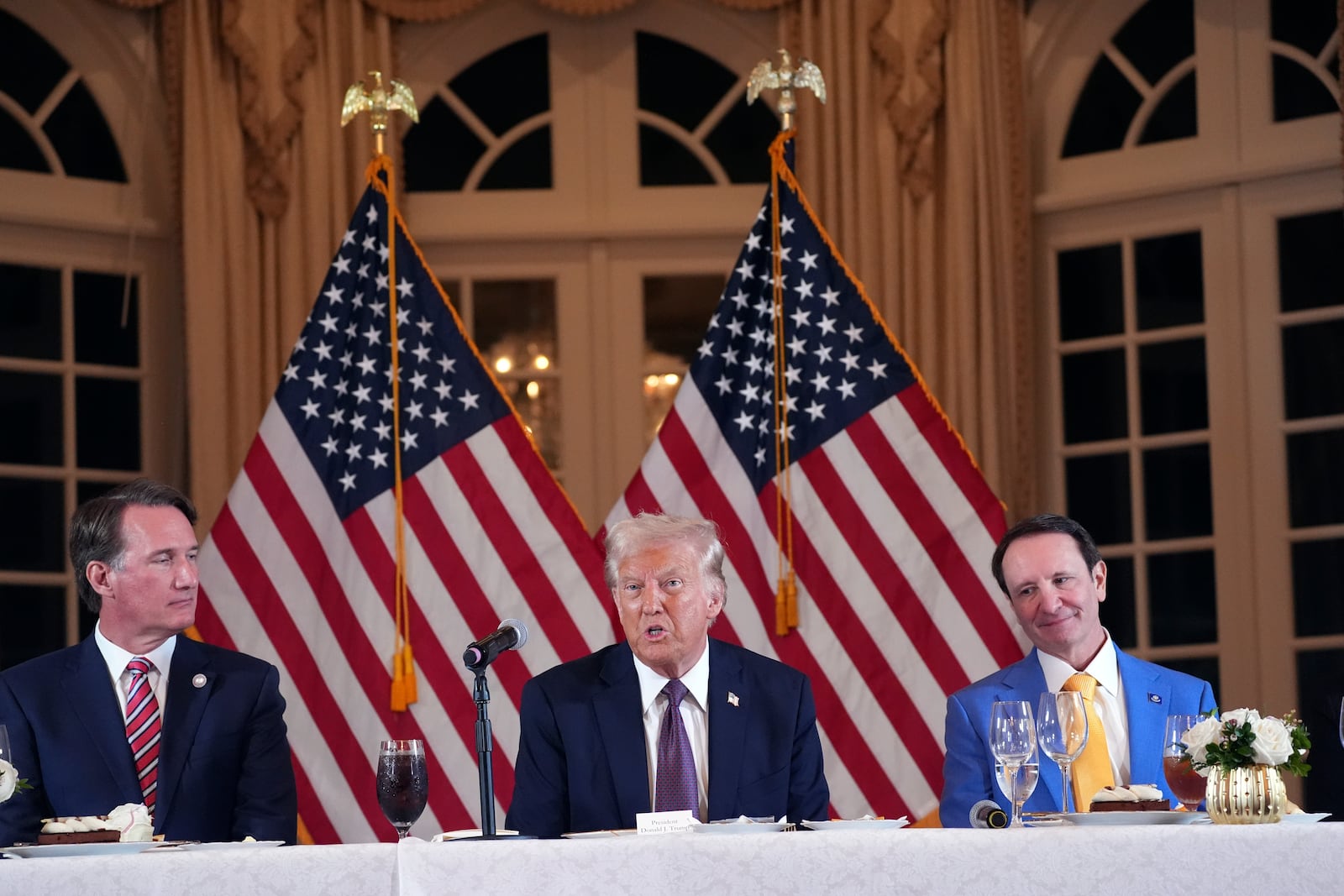 President-elect Donald Trump speaks during a meeting with Republican governors at Mar-a-Lago, Thursday, Jan. 9, 2025, in Palm Beach, Fla., as Virginia Gov. Glenn Youngkin and Louisiana Gov. Jeff Landry listen (AP Photo/Evan Vucci)