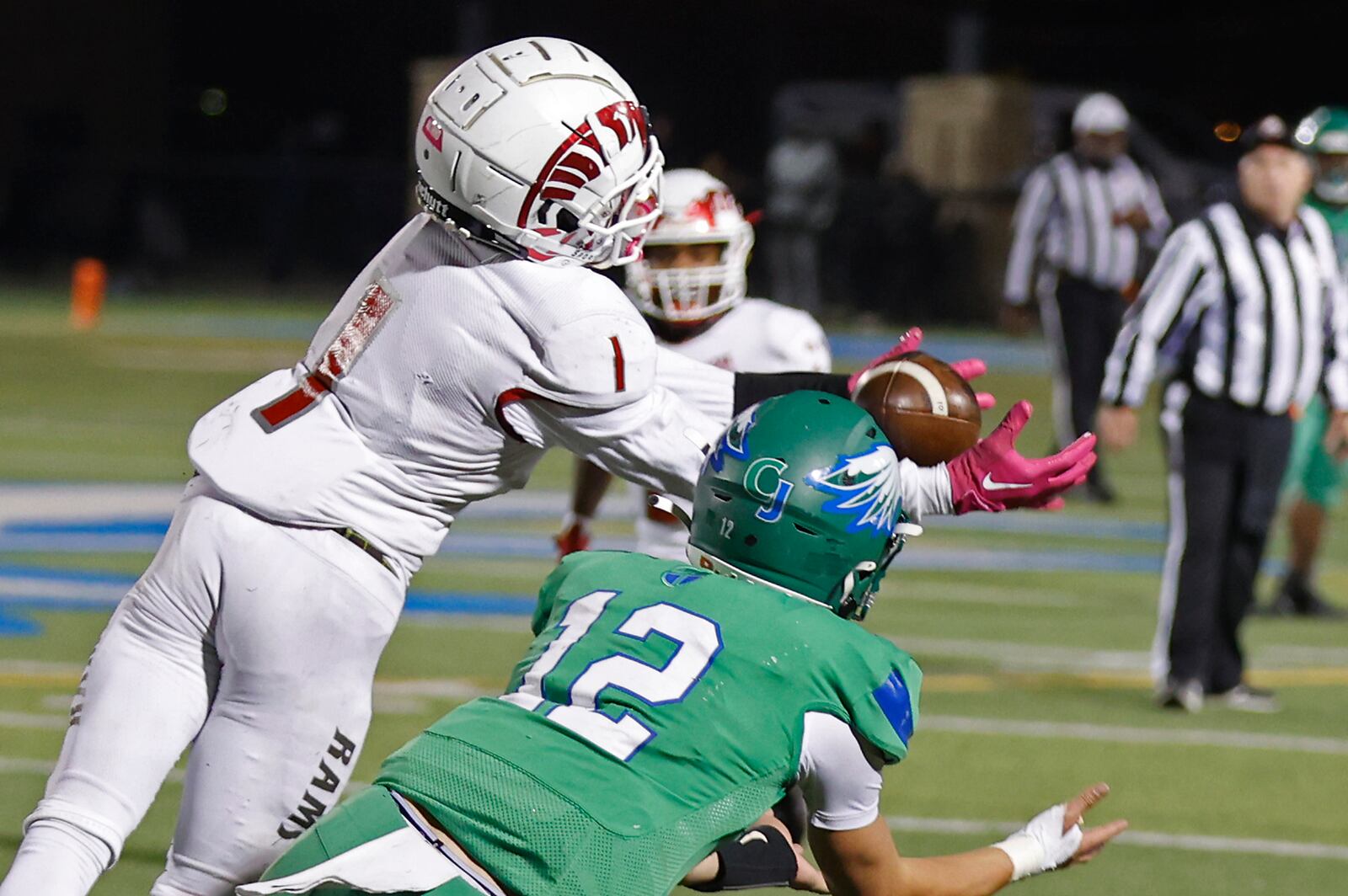 Trotwood's Michael Smith intercepts a pass meant for CJ's Jonathan Peltier during Friday's game. BILL LACKEY/STAFF