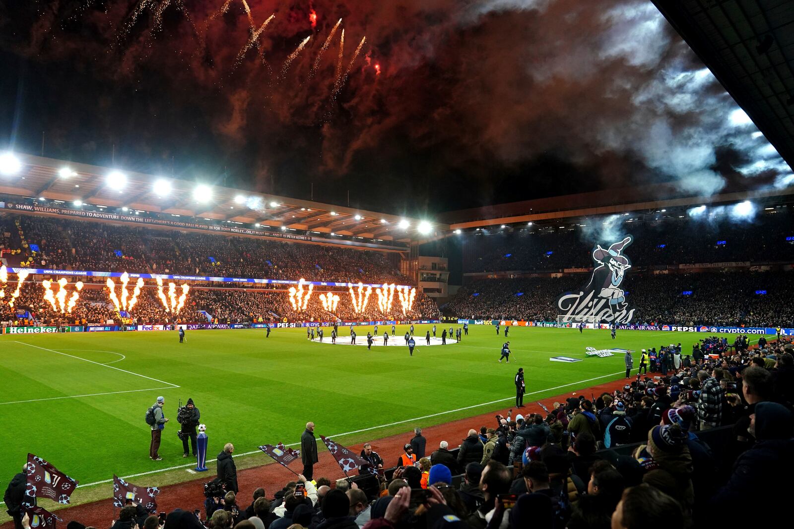 A general view as pyrotechnics are set off during pre-match entertainment before the Champions League opening phase soccer match between Astin Villa and Juventus at Villa Park in Birmingham, England, Wednesday, Nov. 27, 2024. (David Davies/PA via AP)