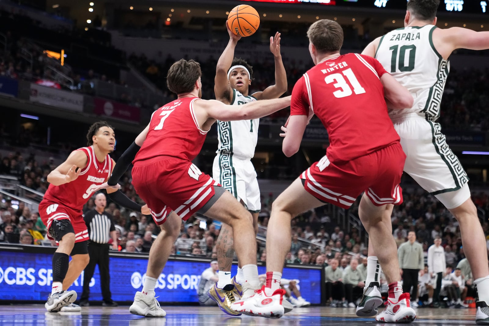 Michigan State guard Jeremy Fears Jr. (1) shoots on Wisconsin forward Carter Gilmore (7) during the first half of an NCAA college basketball game in the semifinals of the Big Ten Conference tournament in Indianapolis, Saturday, March 15, 2025. (AP Photo/Michael Conroy)