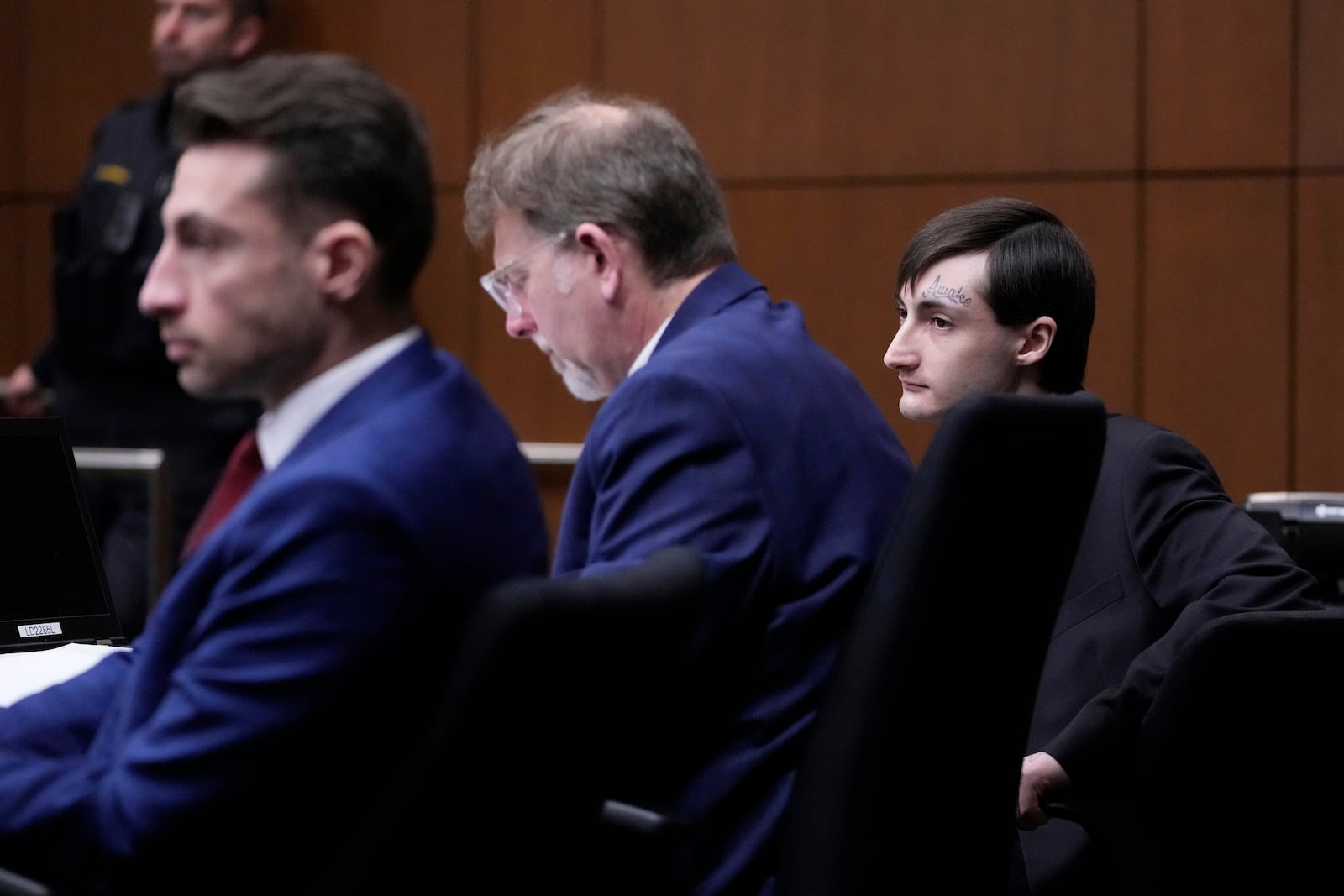 Robert E. Crimo III., right, watches the jury selection process during the first day of the trial of Robert E. Crimo III., at the Lake County Courthouse, Waukegan, Ill., Monday, Feb. 24, 2025. (AP Photo/Nam Y. Huh, Pool)