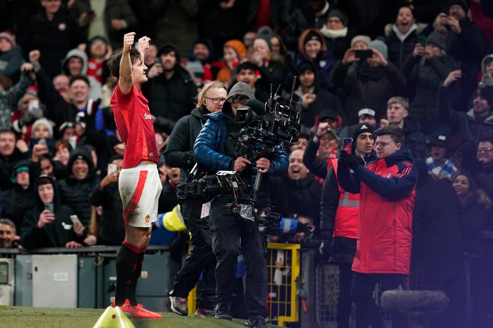 Manchester United's Harry Maguire celebrates after scoring his side's second goal during the English FA Cup fourth round soccer match between Manchester United and Leicester City at the Old Trafford stadium in Manchester, England, Friday, Feb. 7, 2025. (AP Photo/Dave Thompson)