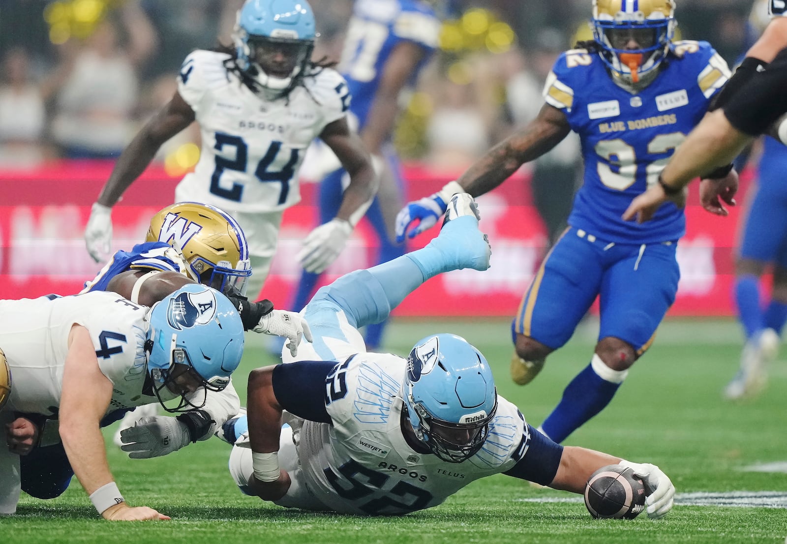 Toronto Argonauts' Peter Nicastro (52) recovers a fumble against the Toronto Argonauts during the second half of a CFL football game at the 111th Grey Cup in Vancouver, British Columbia, Sunday, Nov. 17, 2024. (Nathan Denette/The Canadian Press via AP)