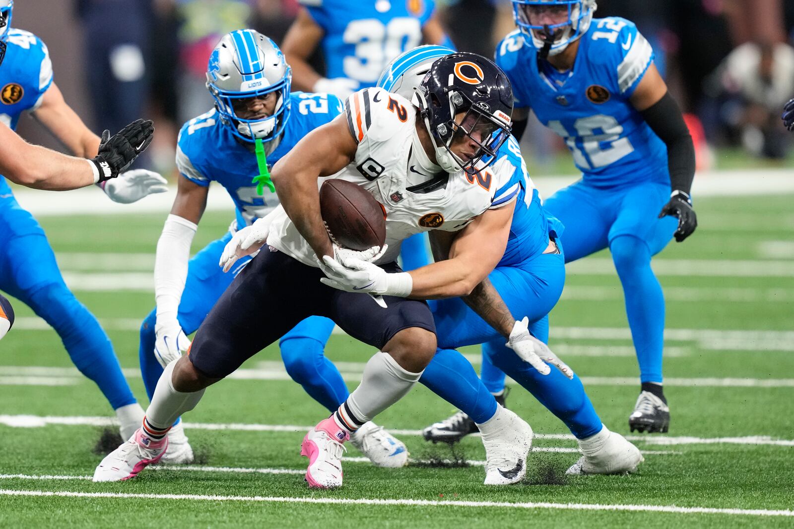 Chicago Bears wide receiver DJ Moore (2) runs for yardage after a catch against the Detroit Lions during the first half of an NFL football game, Sunday, Nov. 17, 2024, in Detroit. (AP Photo/Carlos Osorio)