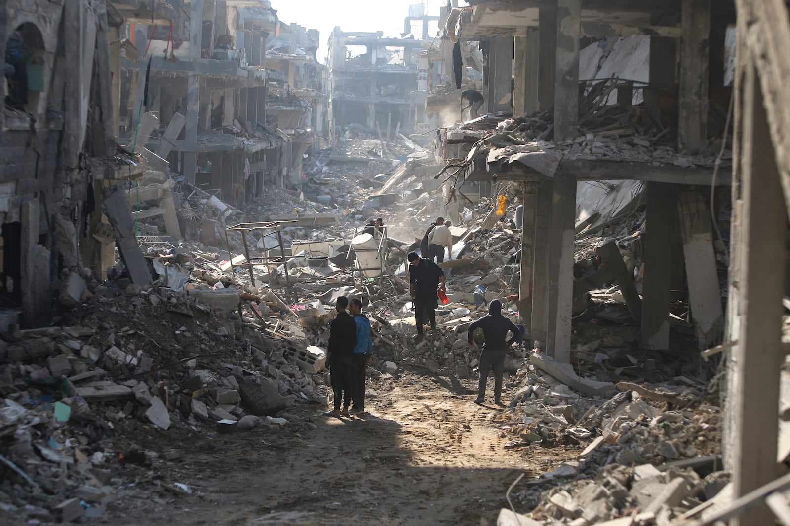 Palestinians who have returned inspect their houses, which were destroyed by Israeli bombardment in Jebaliya, northern Gaza Strip, Wednesday, Jan. 29, 2025. (AP Photo/Jehad Alshrafi)